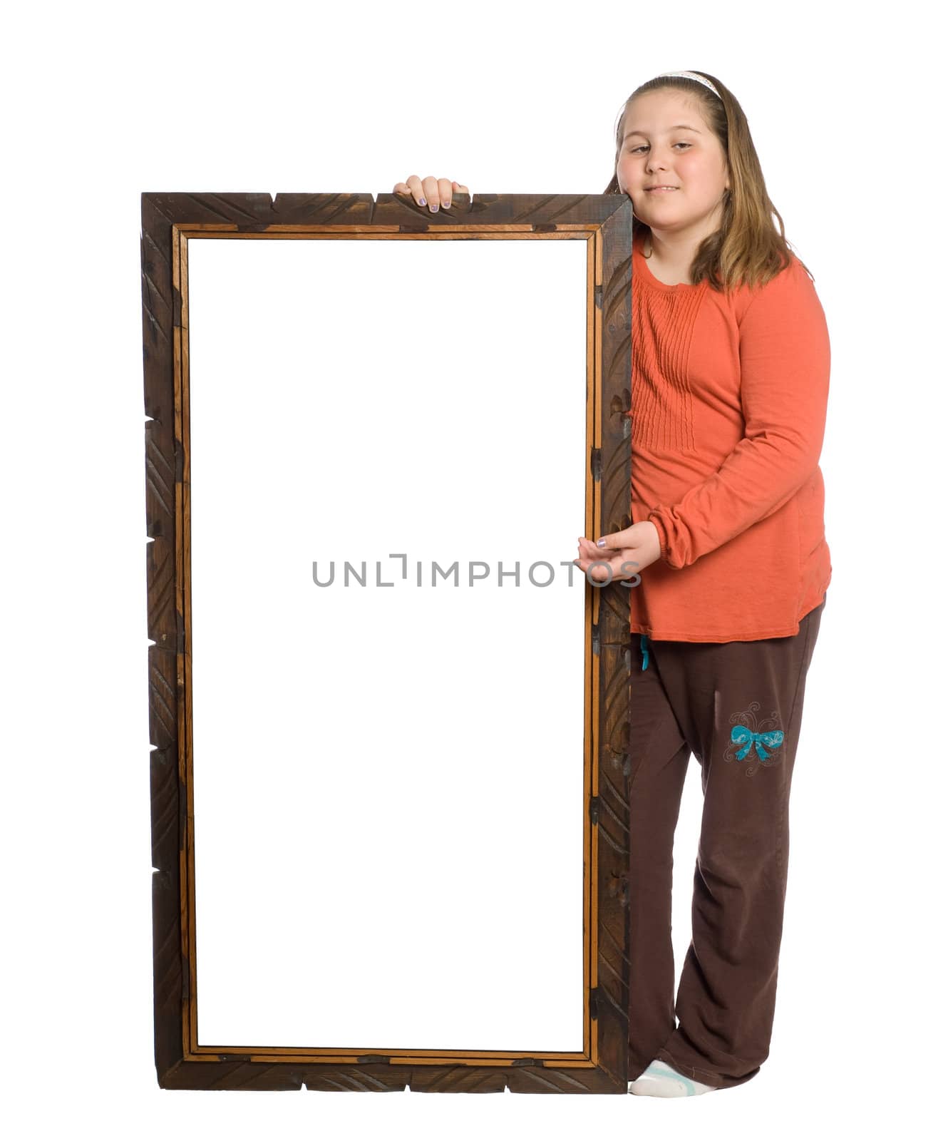 Full body view of a young girl holding a sign with a wooden border, isolated against a white background