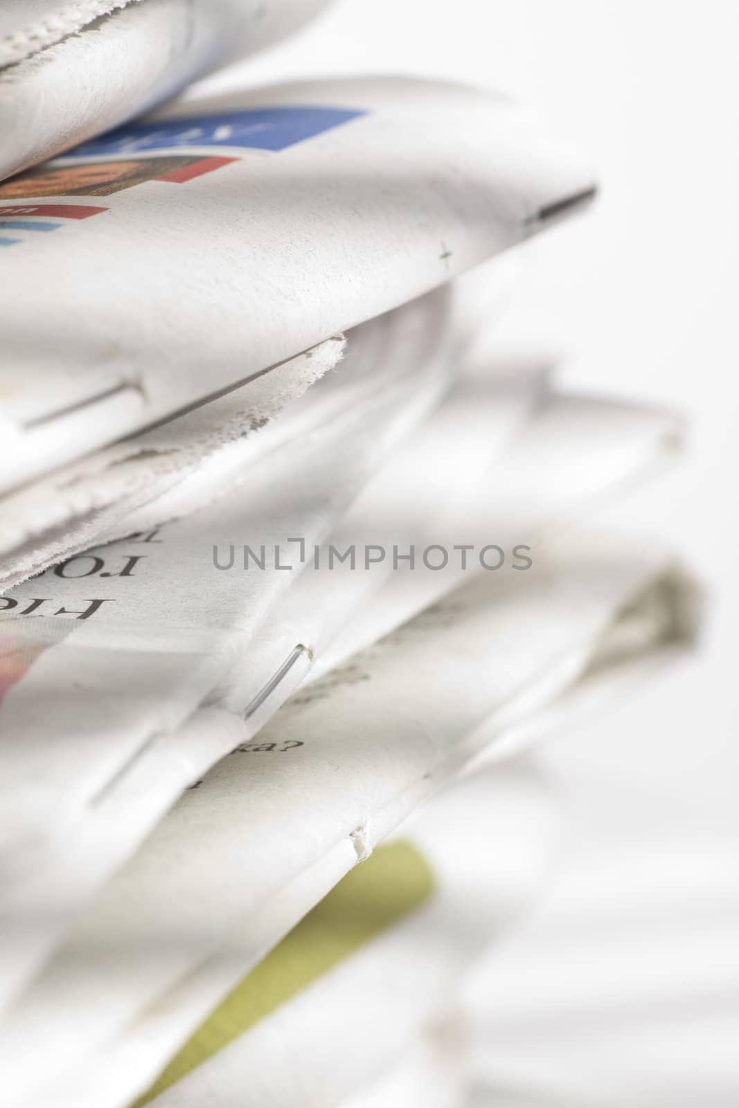 pile of newspapers on the table