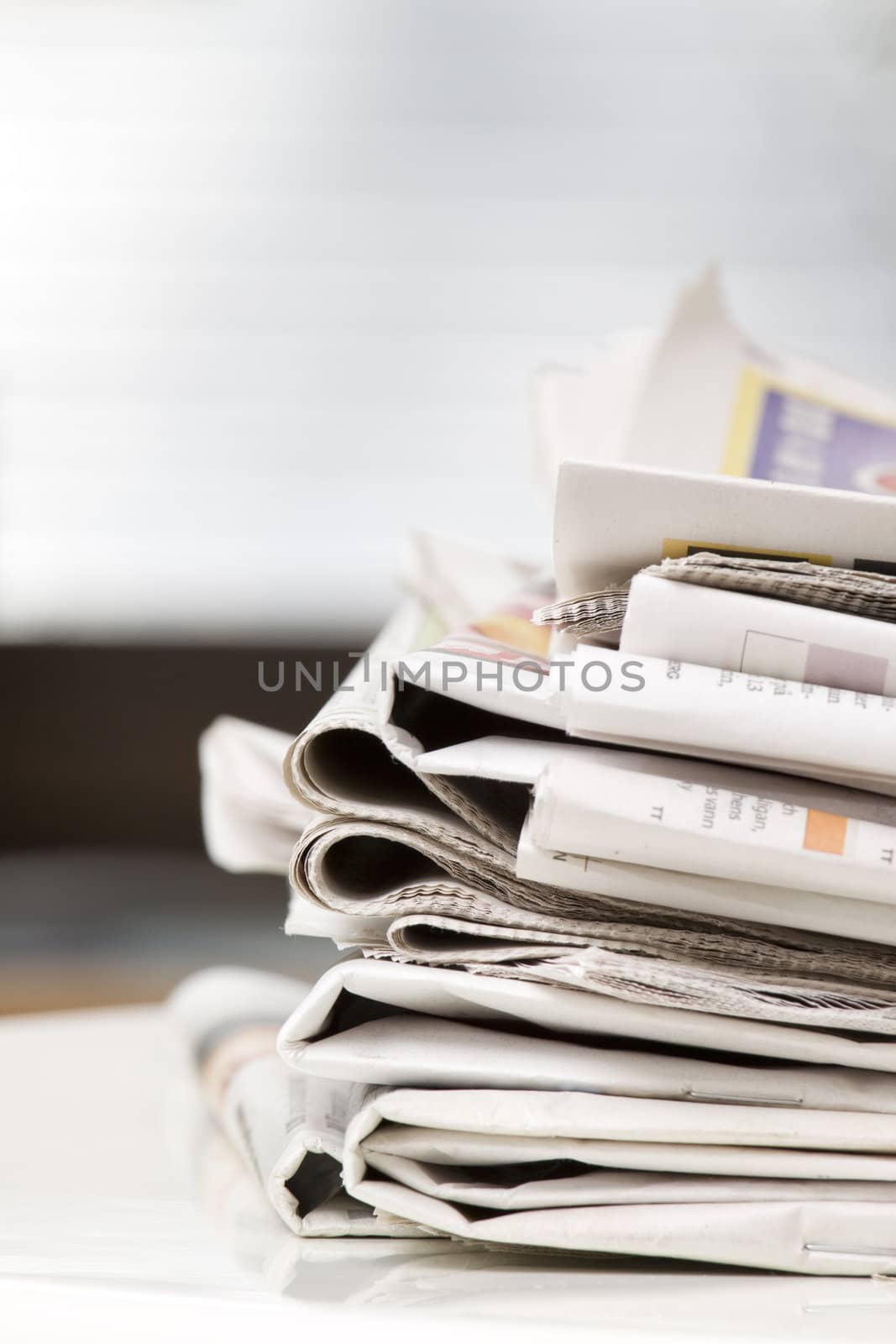 pile of newspapers on the table