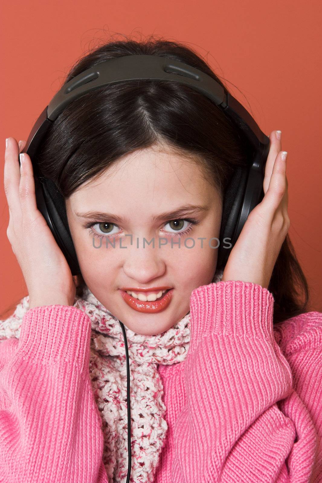girl listening music in headphones by vladacanon