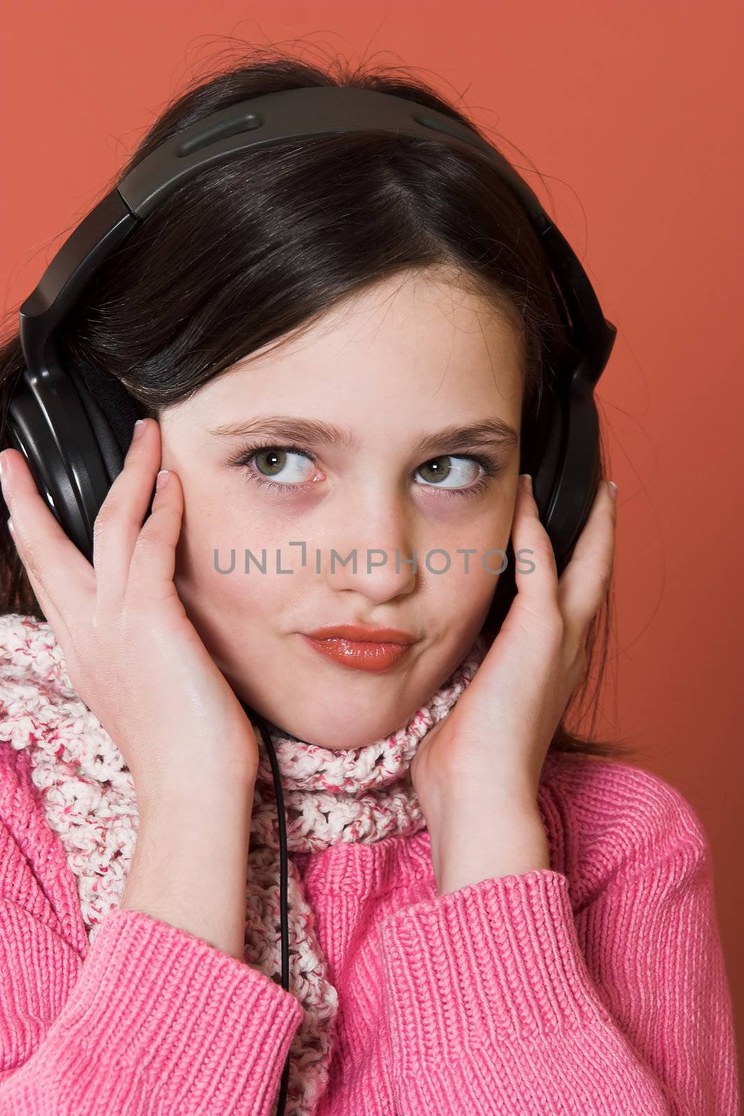 girl listening music in headphones by vladacanon