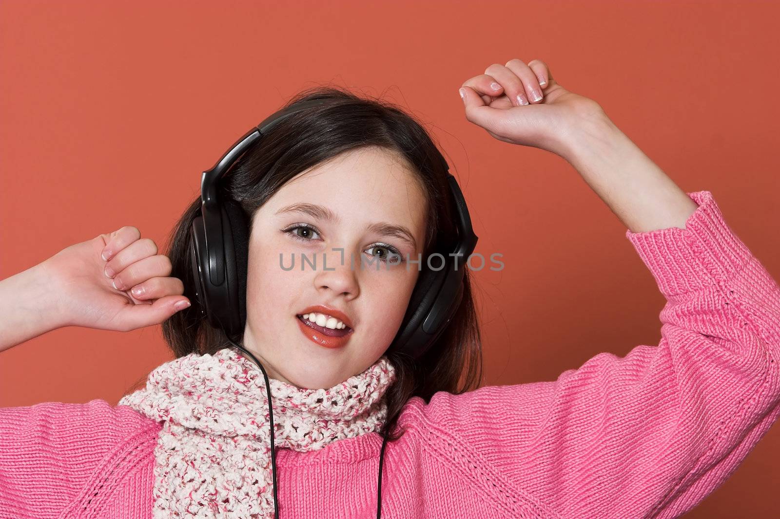 girl listening music in headphones by vladacanon