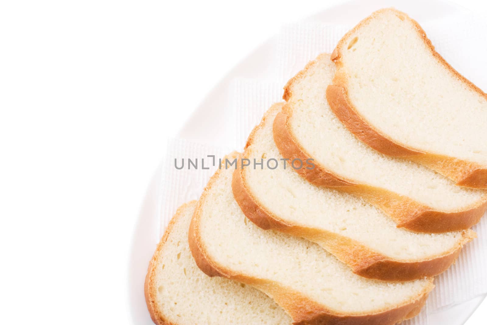 Sliced Bread on the plate isolated over white. Bon appetit!