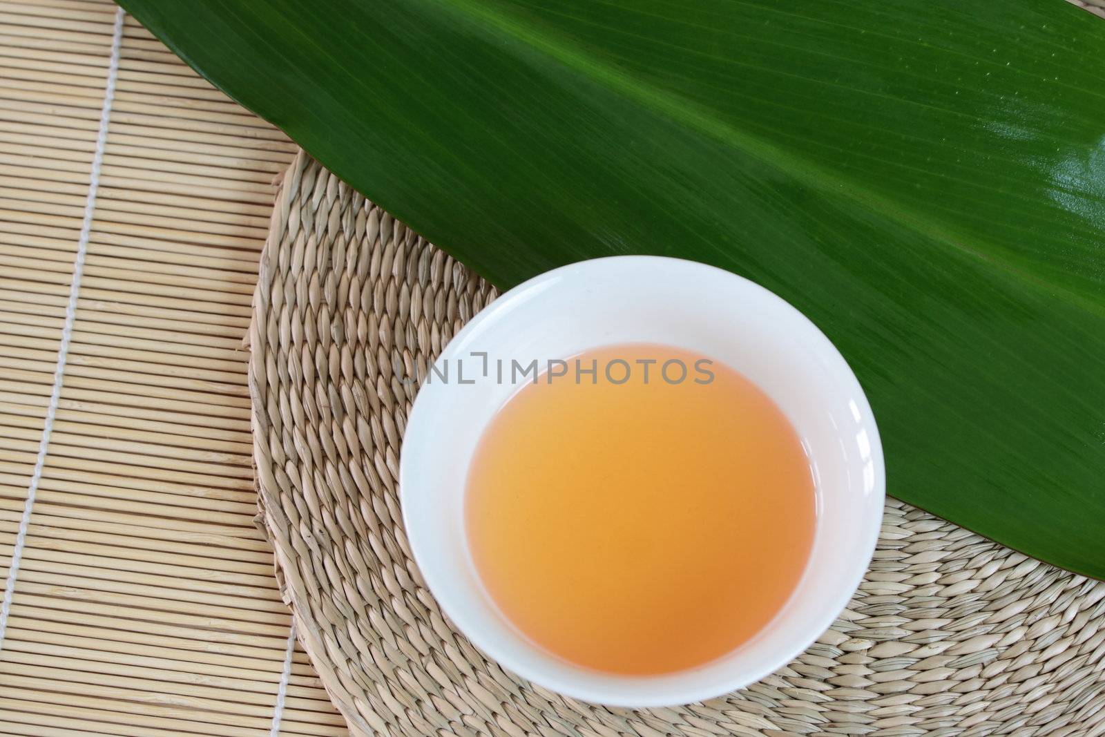 Tropical Spa background (green leaf, white flowers, oil)