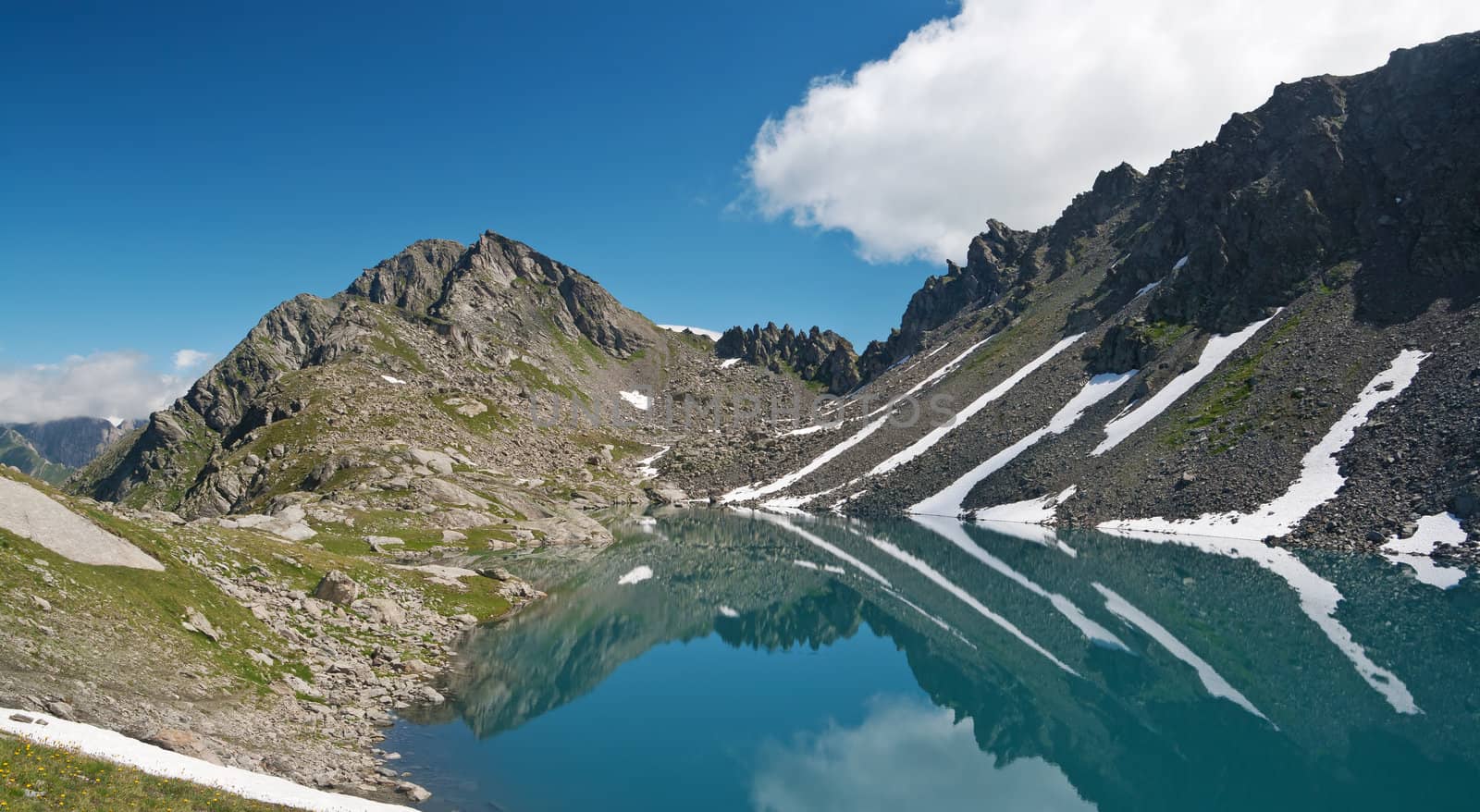 summer view of Red Stone Lake, Aosta valley, Italy