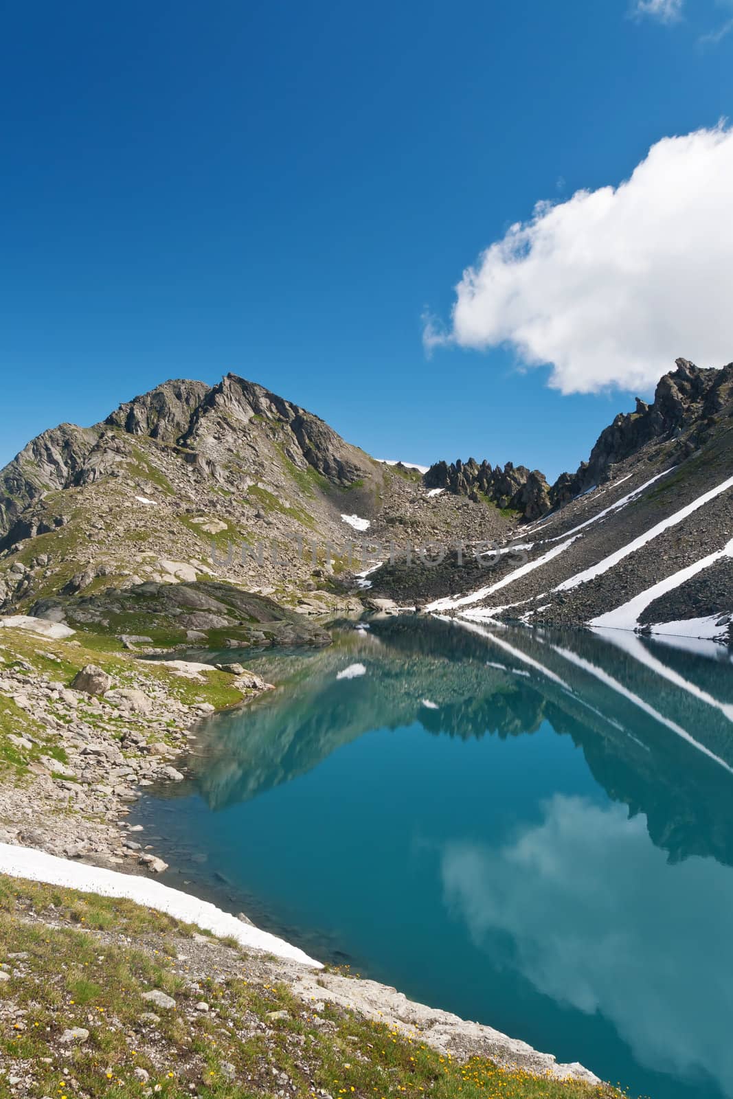 summer view of Pietra Rossa (Red Stone) lake in Aosta valley, Italy