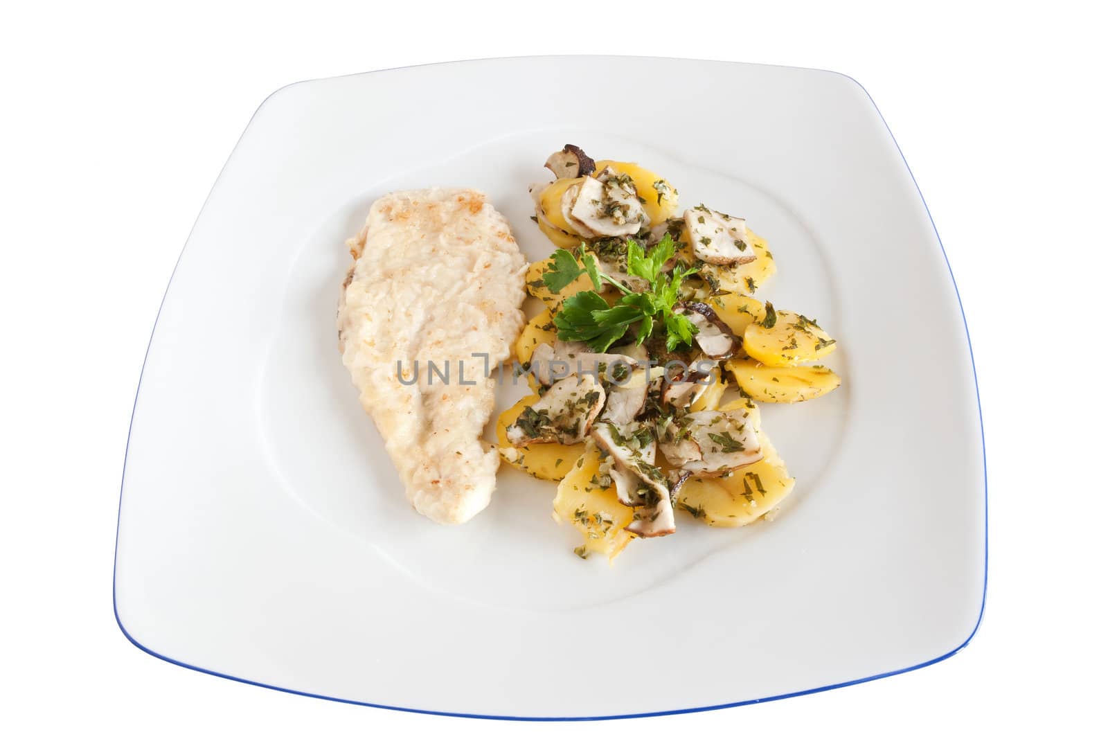 chicken escalope with baked potatoes and mushrooms isolated on white with clipping path