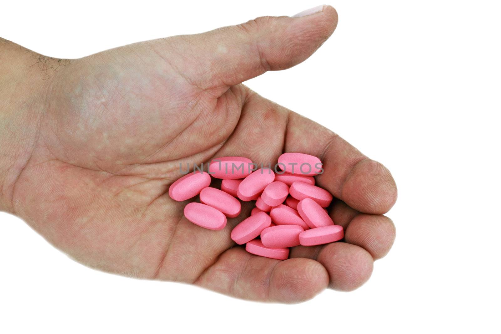 Male hand filled with perscription pain pills isolated on white with clipping path included.
