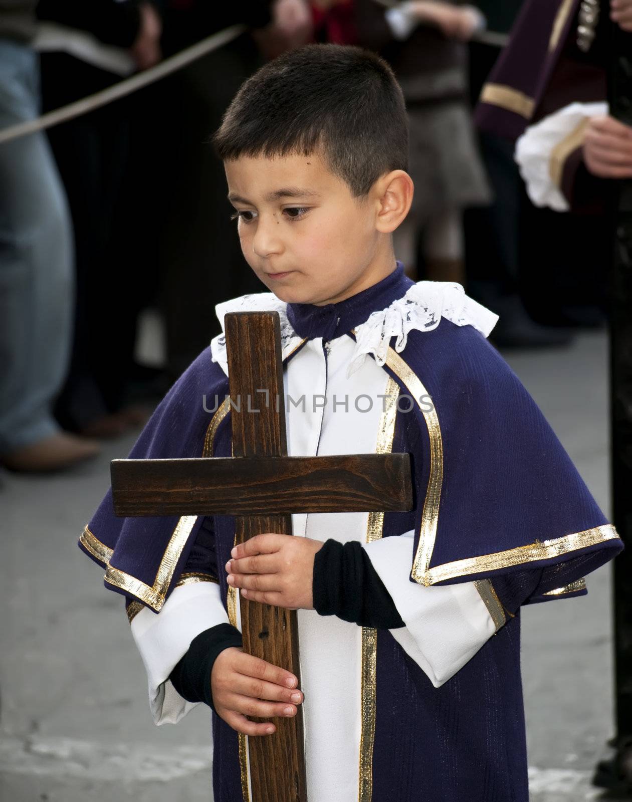 LUQA, MALTA - Friday 10th April 2009 - Little boy carrying cross during the Good Friday procession in Malta