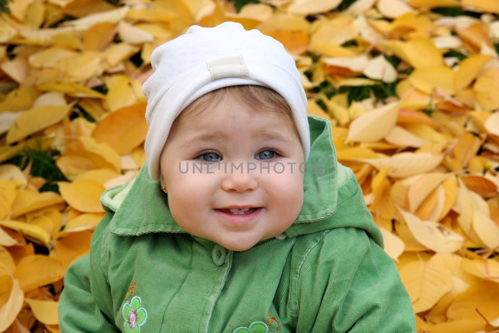 baby at a park in Autumn by vladacanon