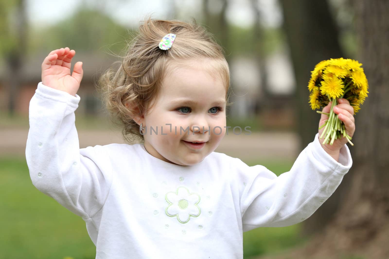 beautiful pretty girl with flower in the park