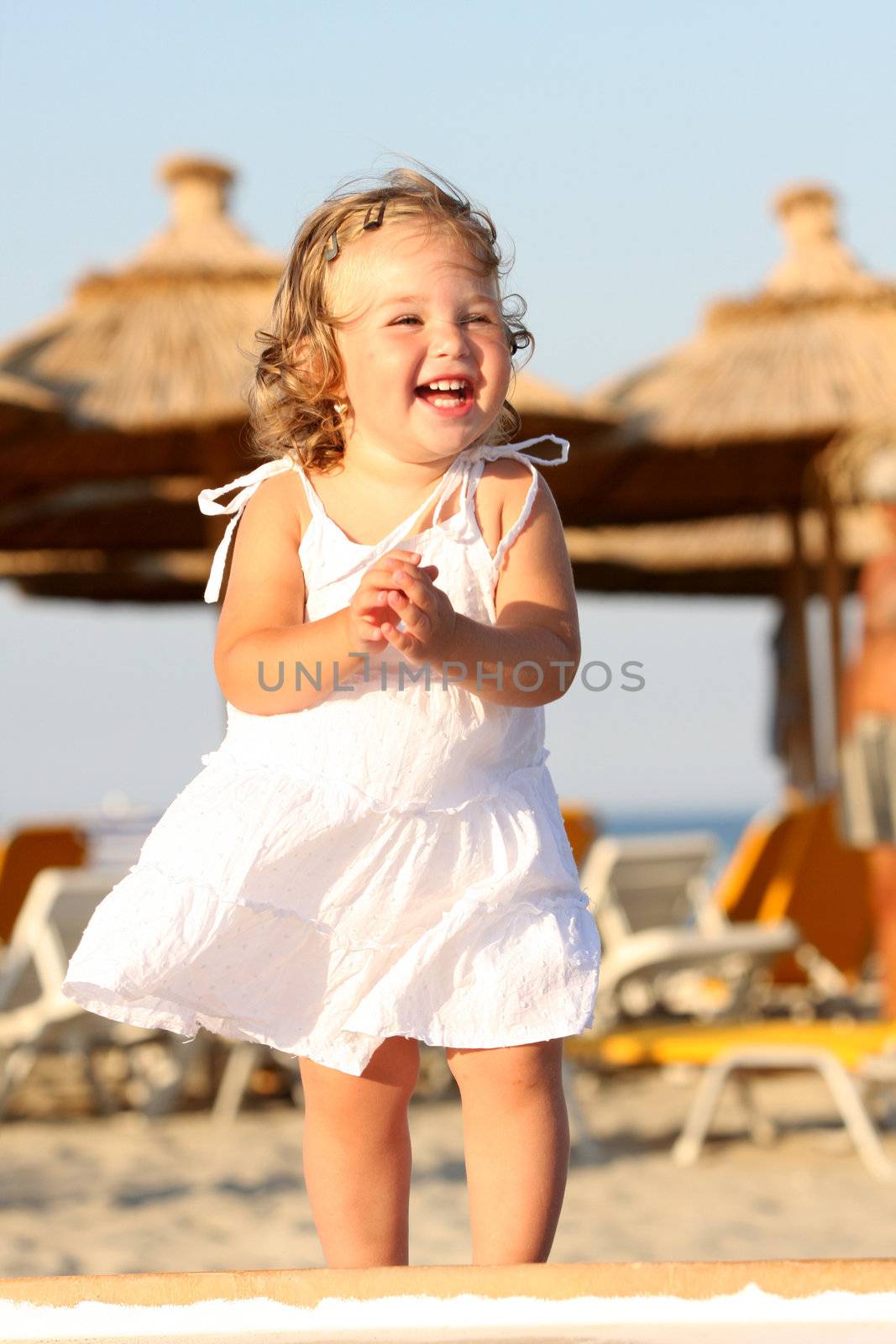 Beauty a little girl at beach in the sea 