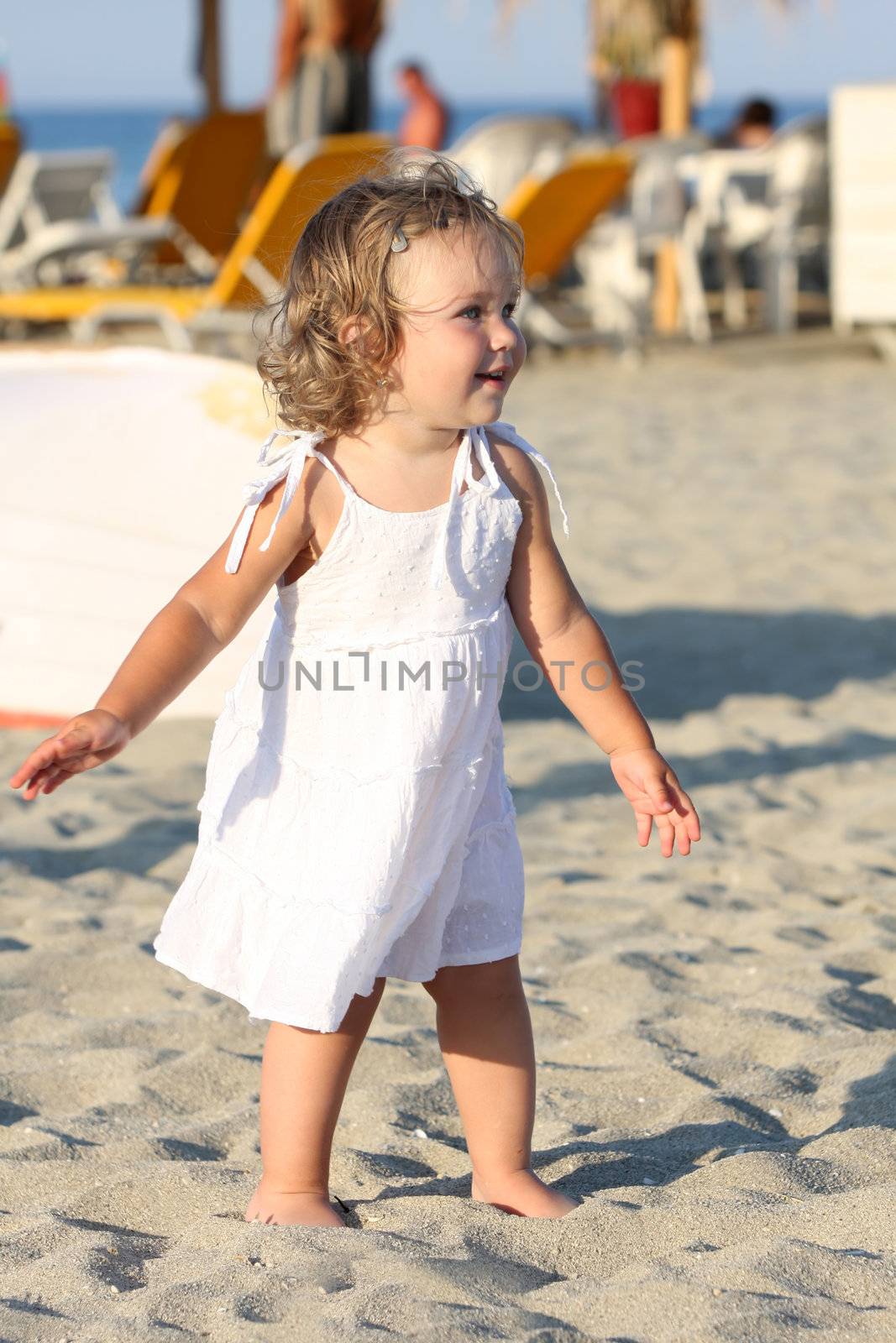 Beauty a little girl at beach in the sea 