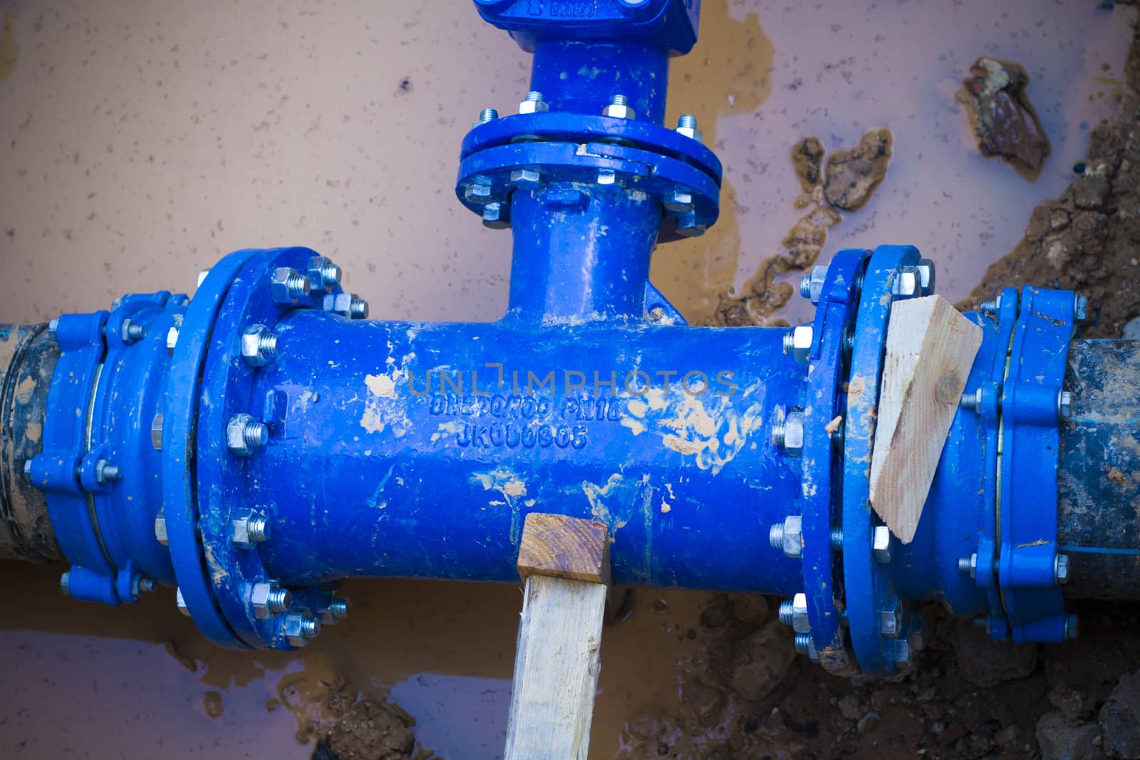 Blue pipe in the street damaged, repair