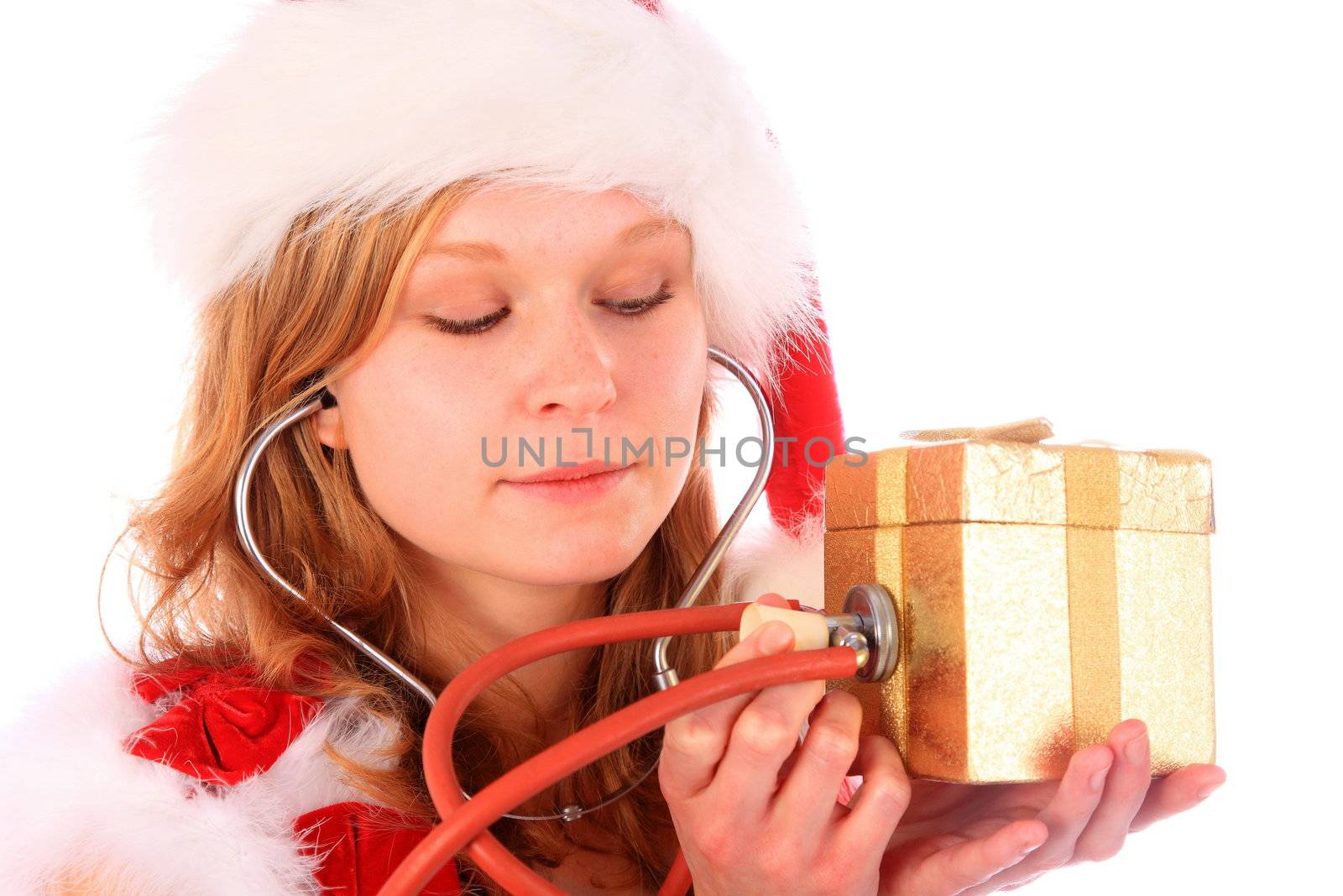 miss santa is sounding a golden gift box with a stetoscope to check out the gift box content - looking at the box