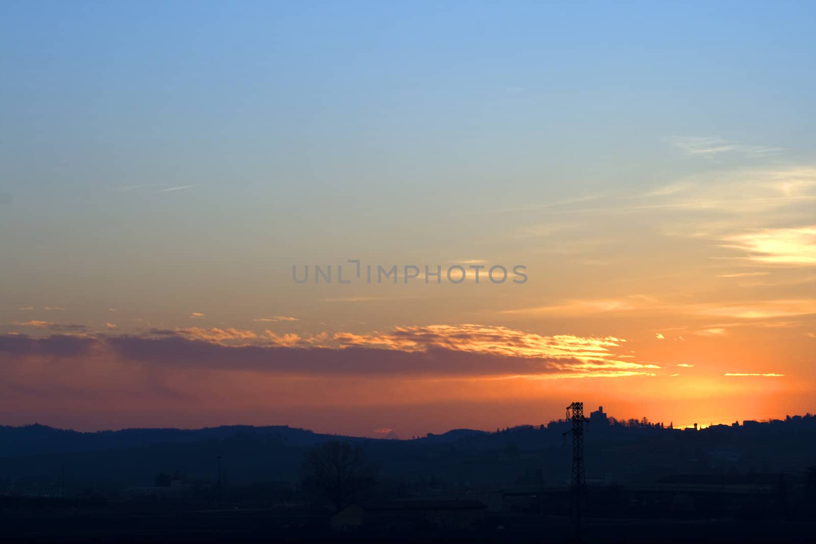 Beautiful sunset with silhouette of a city