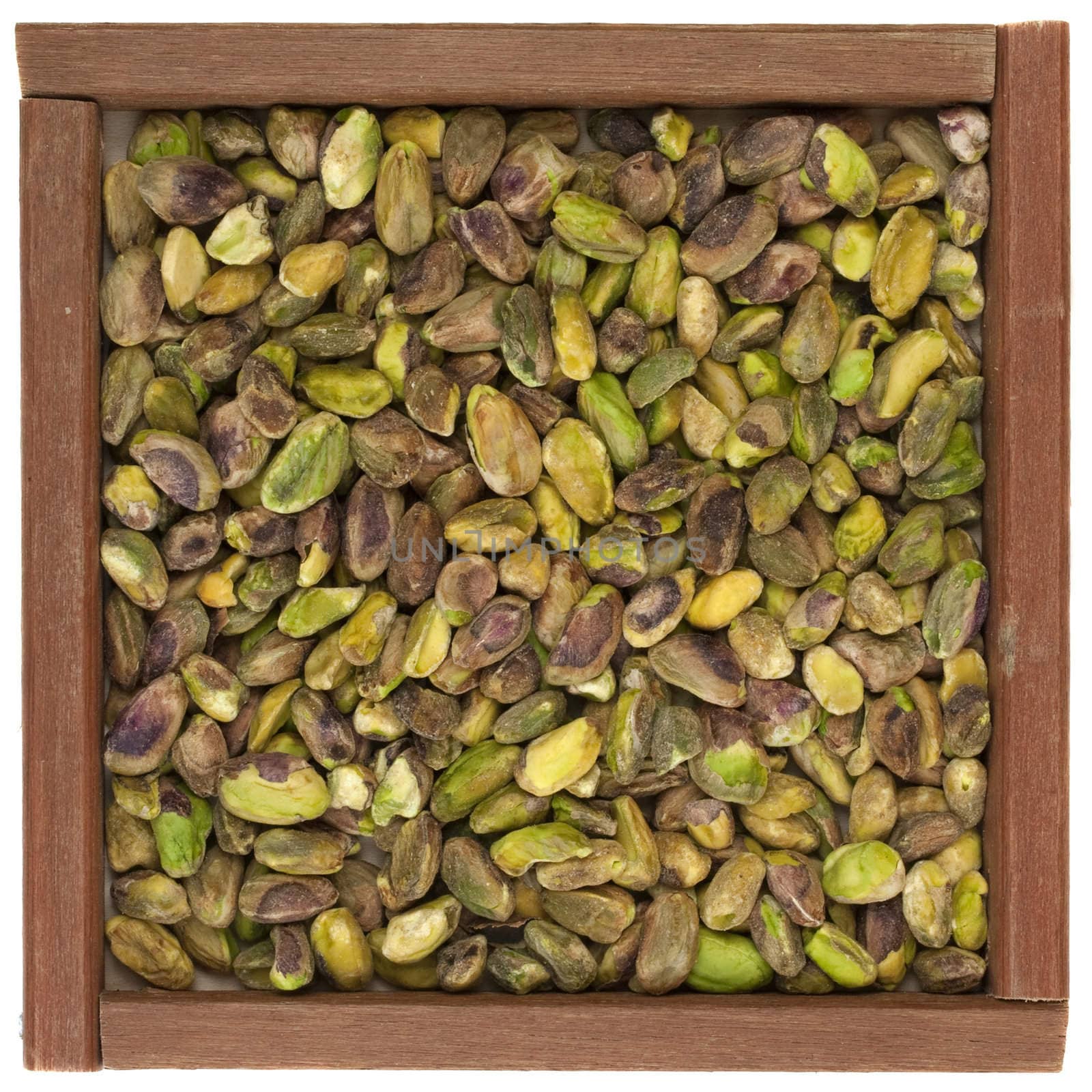 raw shelled pistachio nuts by PixelsAway