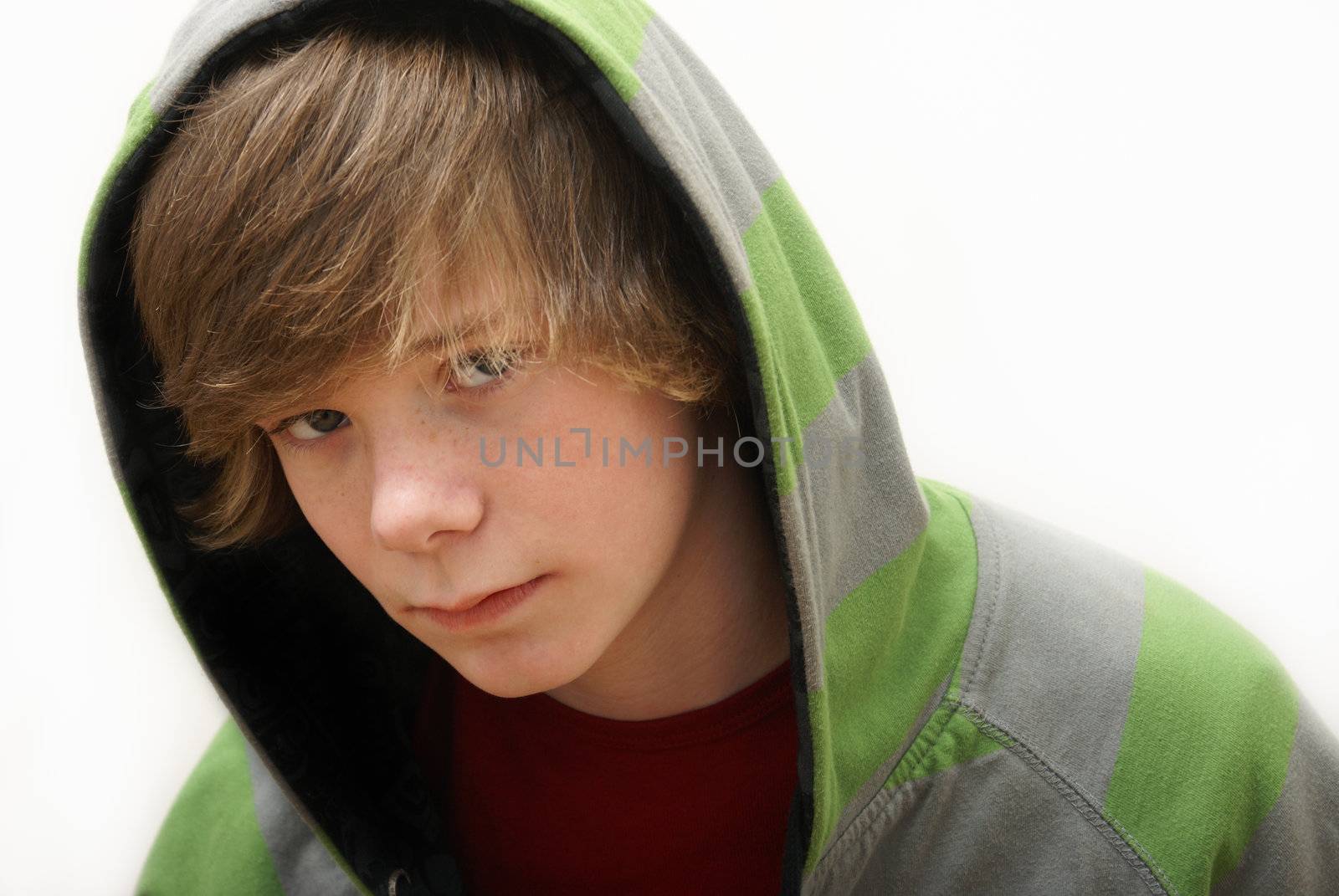 A young teenage boy wearing a green and gray hoodie.