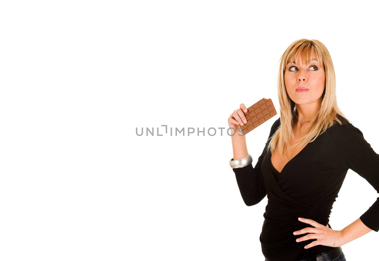 young girl eating chocolate on white background