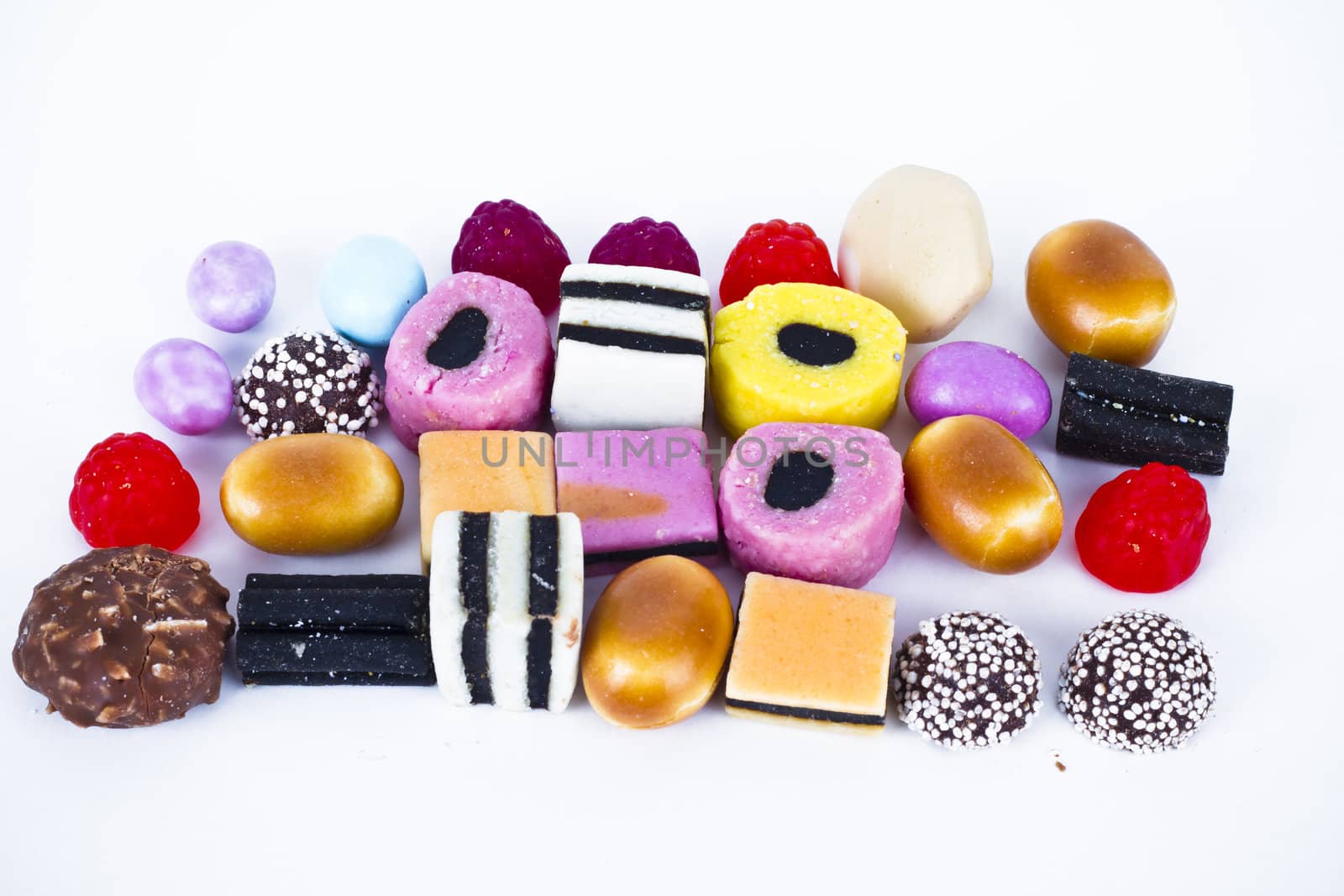 Many candy on white background.Fruit snacks by FernandoCortes