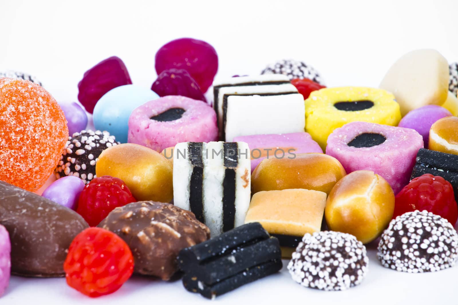 Many candy on white background.Fruit snacks by FernandoCortes