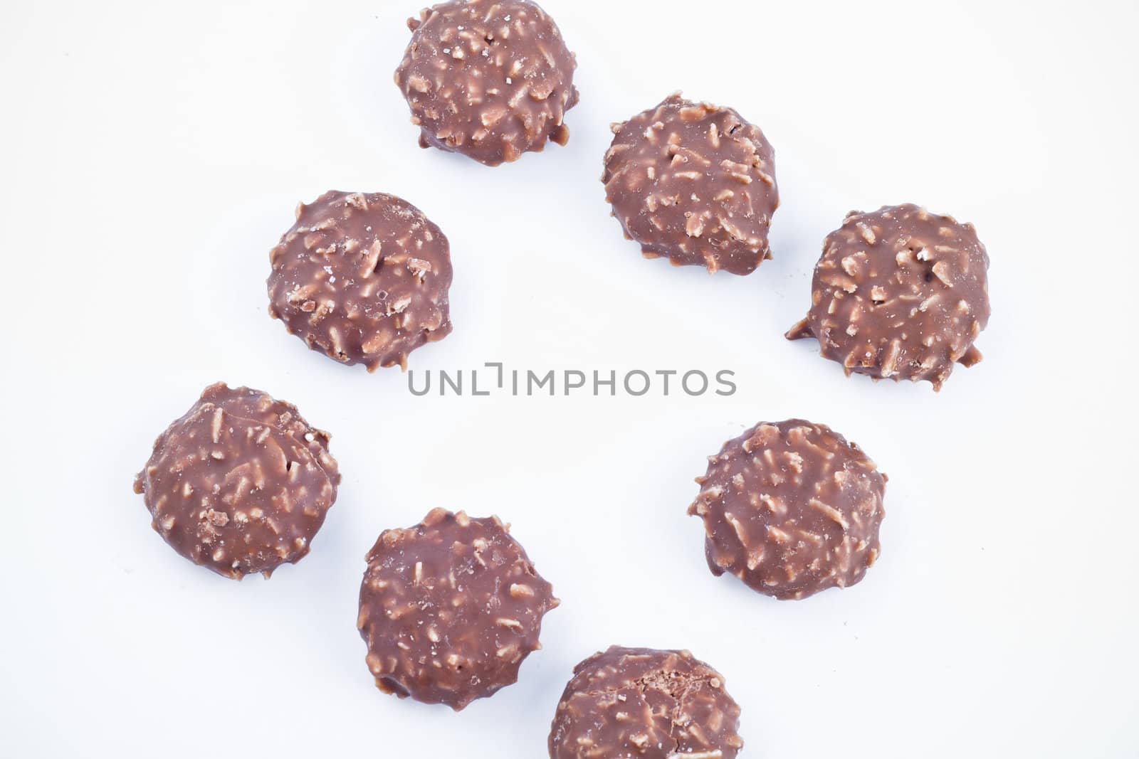 Chocolate candy over white background. by FernandoCortes