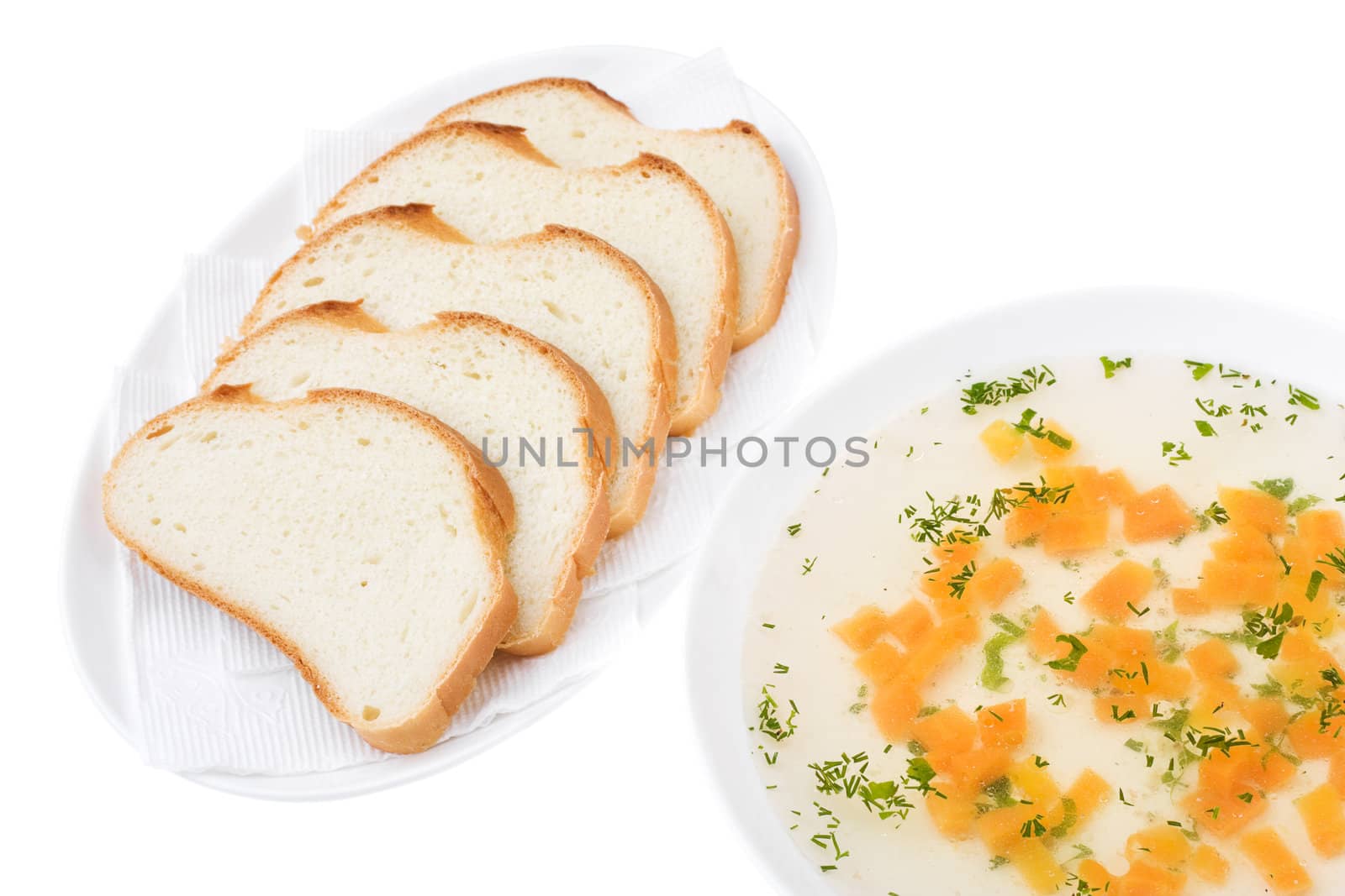 Clear Chicken Broth with Sliced Bread isolated over white. Bon appetit!