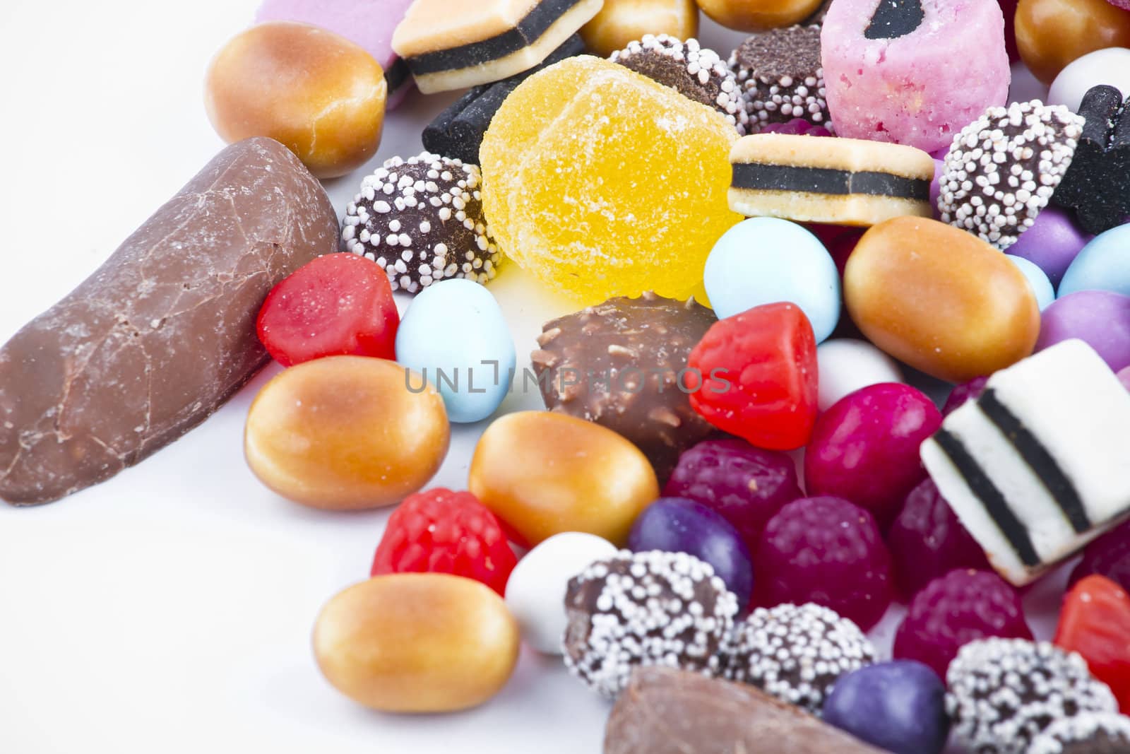 Many candy on white background.Fruit snacks by FernandoCortes