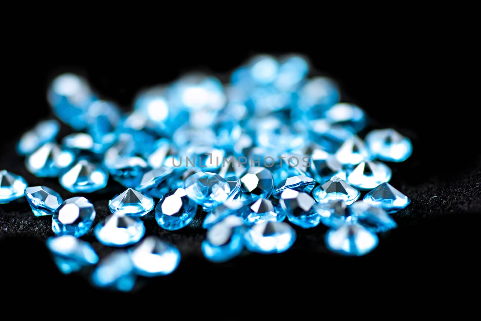 On a black background, blue diamonds, the focus is in the middle.
