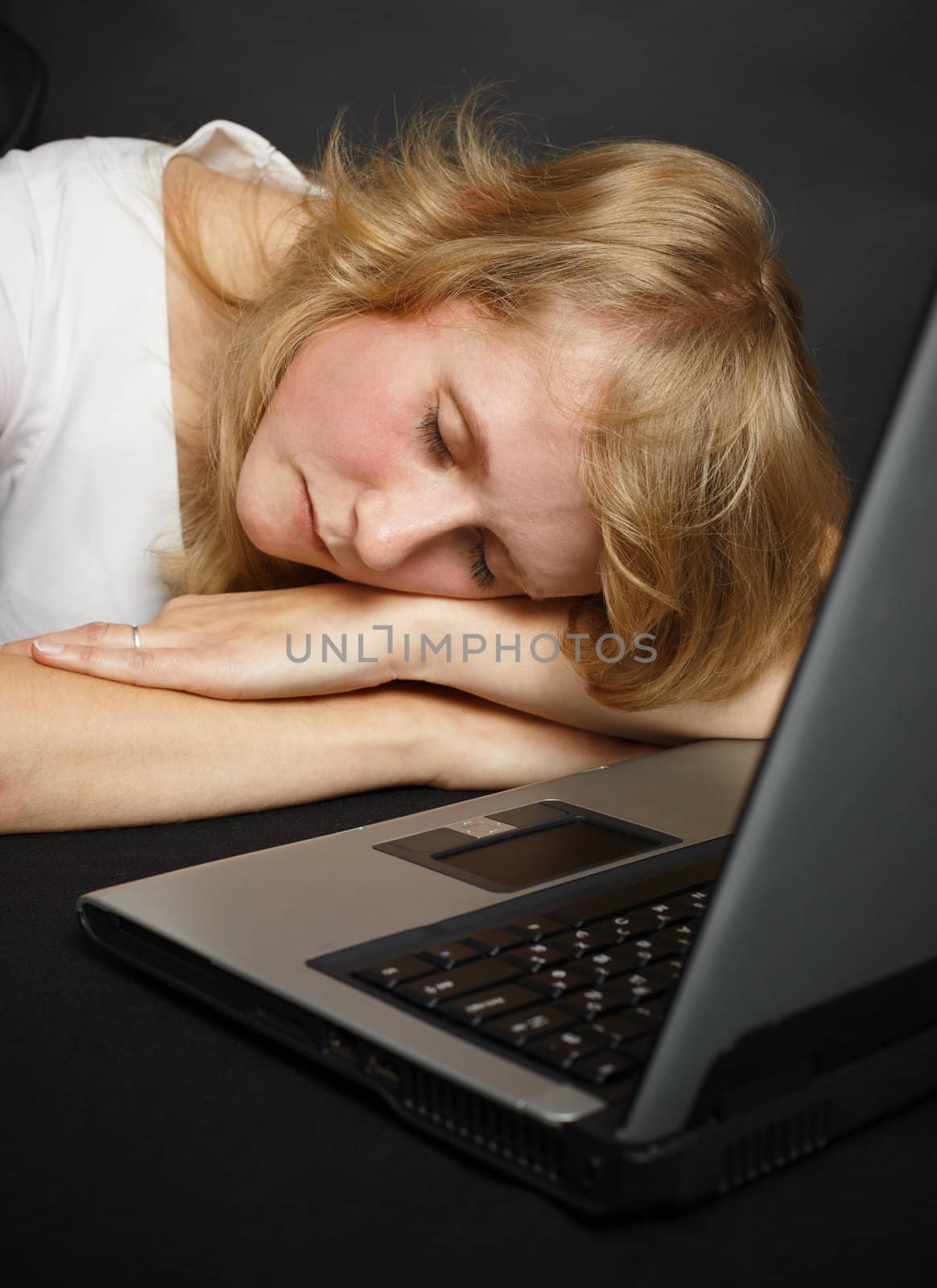 Woman asleep at table near computer by pzaxe