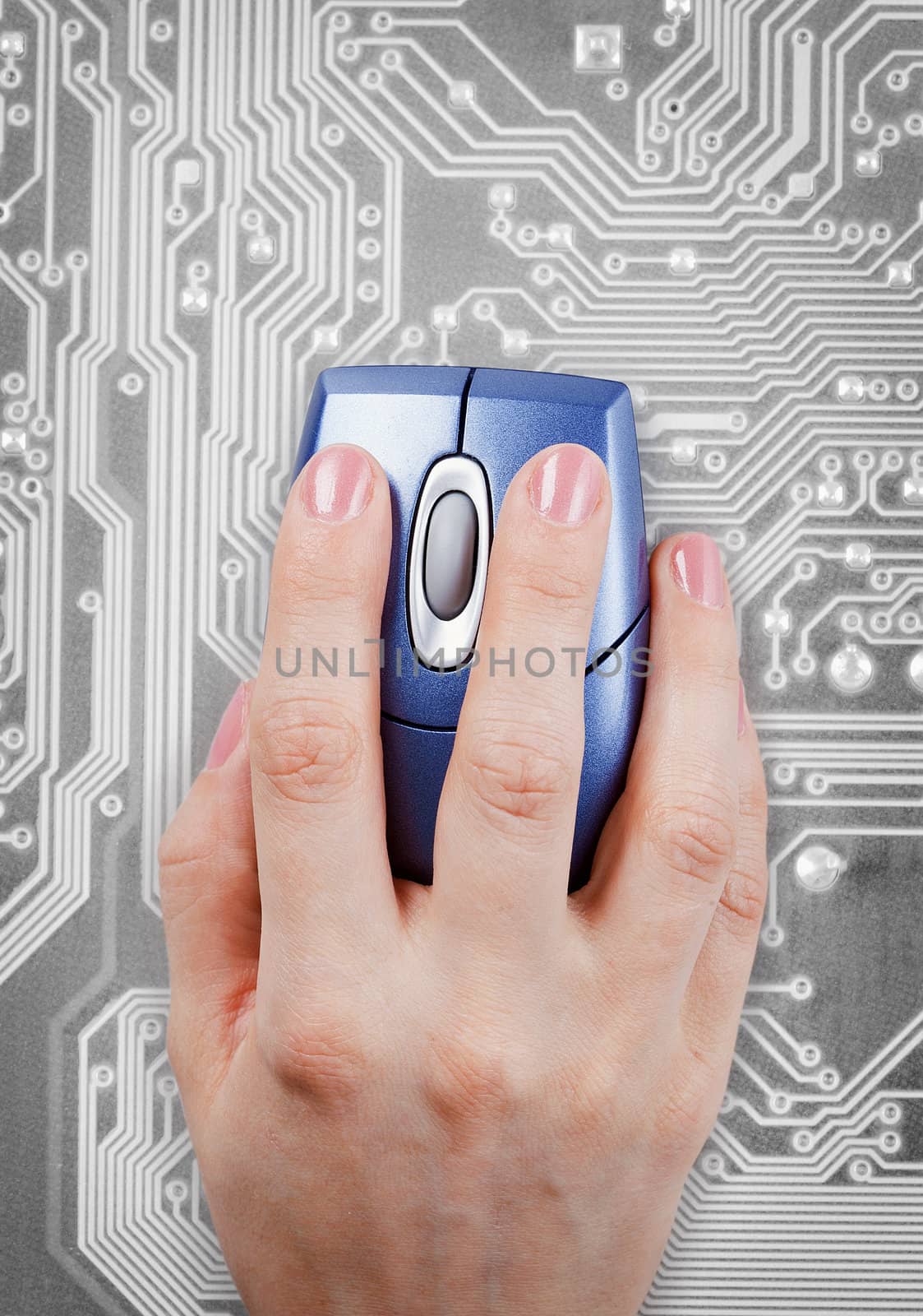 Hand and computer mouse on an gray electronic background