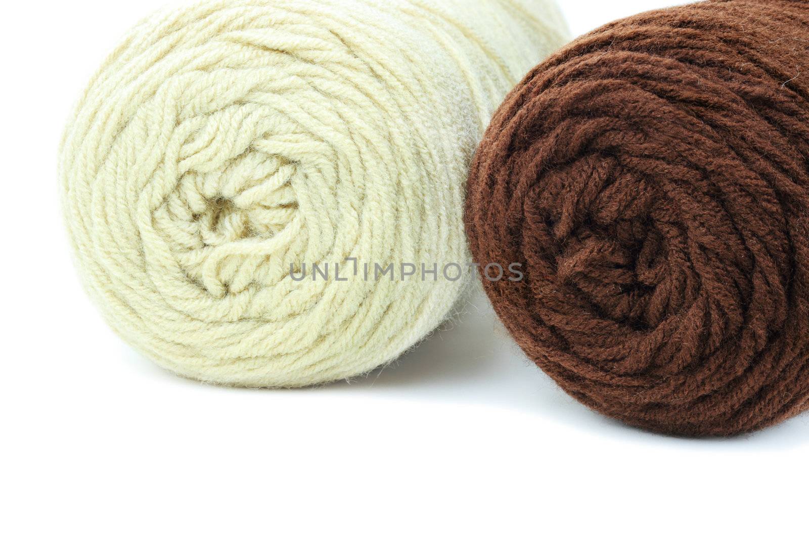 White and brown yarn with light shadow. 