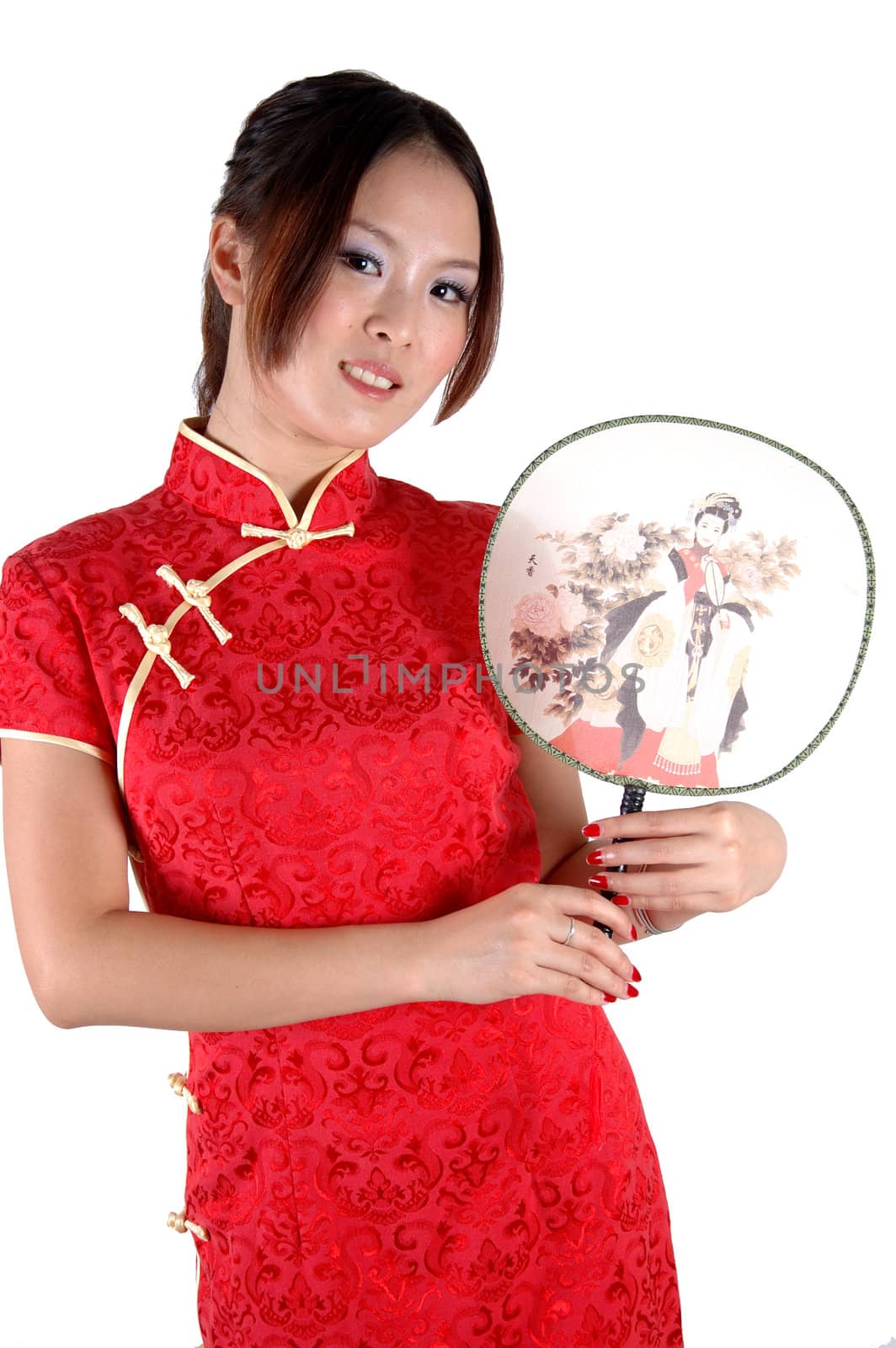 Smiling Chinese girl with fan. Pretty Asian model, wearing traditional dress, smiling.