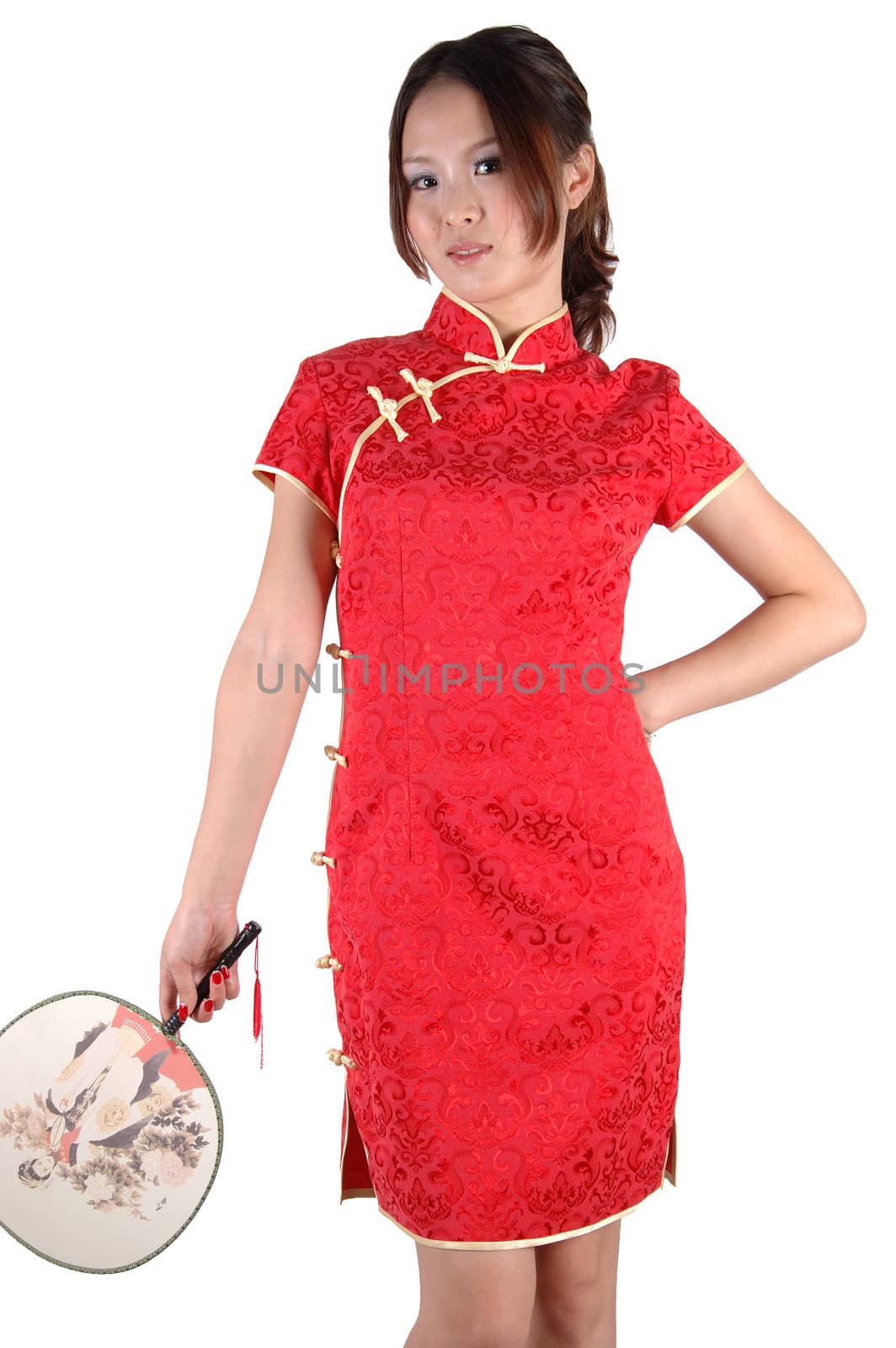 Chinese model in traditional dress called QiPao, holding fan. Asian cute girl, young model with friendly and happy face expression.