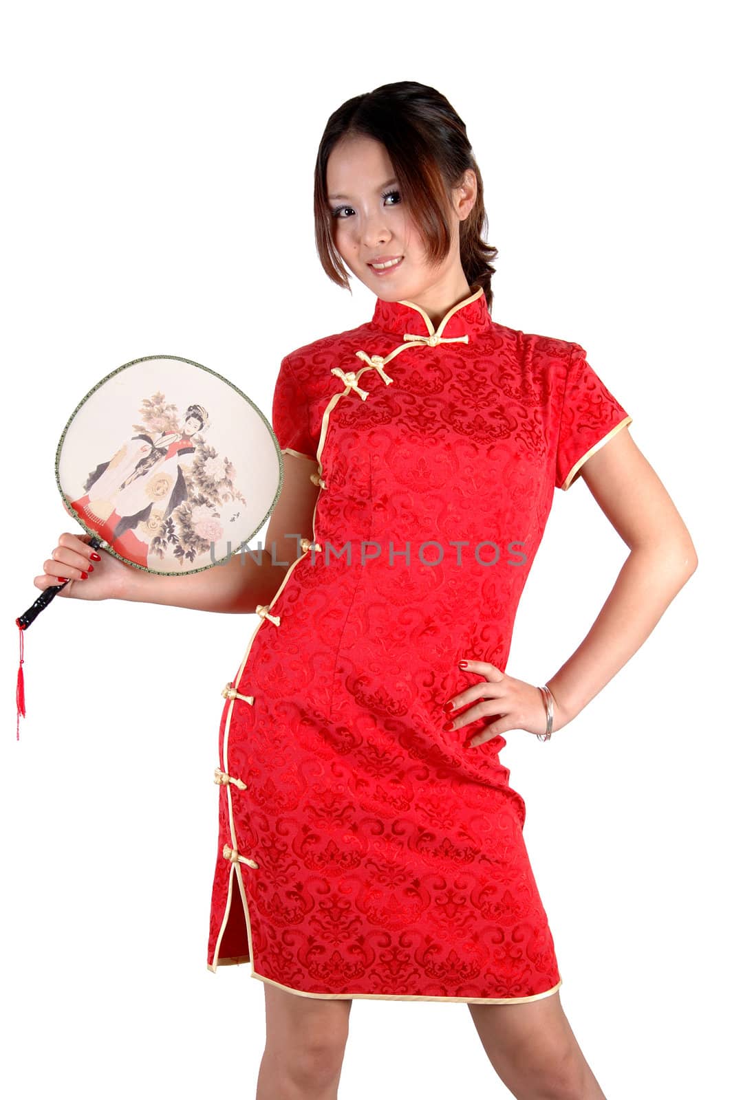 Chinese model in traditional dress called QiPao, holding fan. Asian cute girl, young model with friendly and happy face expression.