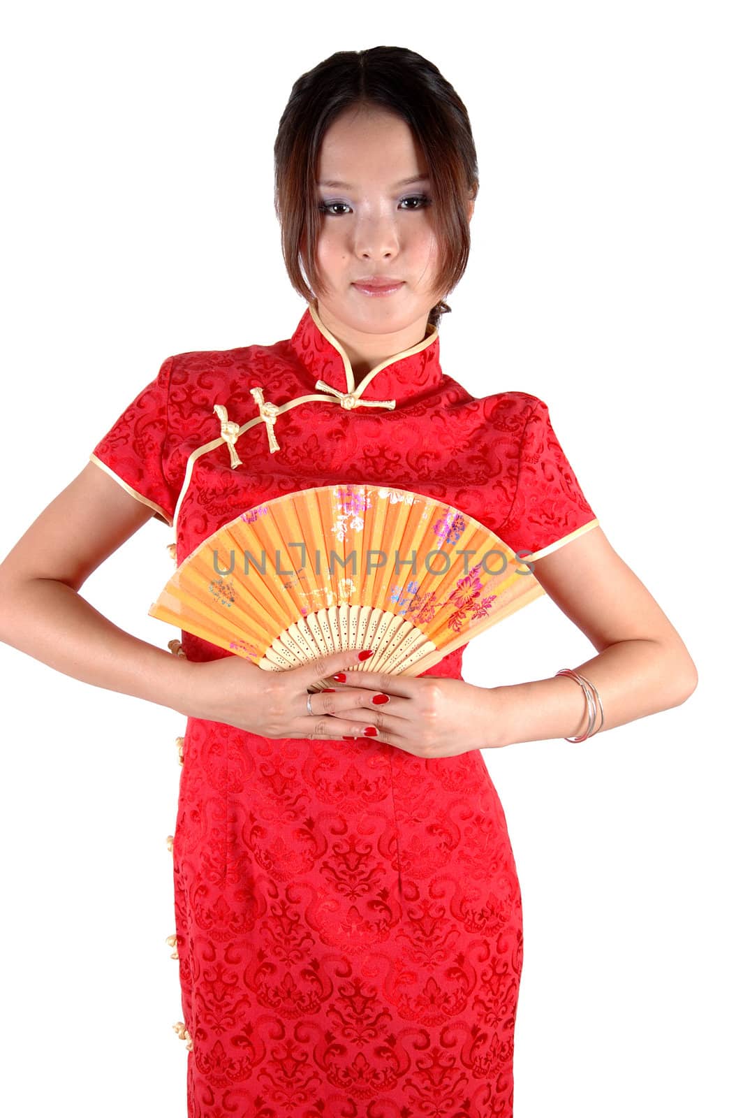 Chinese model in traditional dress called QiPao, holding fan. Asian cute girl, young model with friendly and happy face expression.