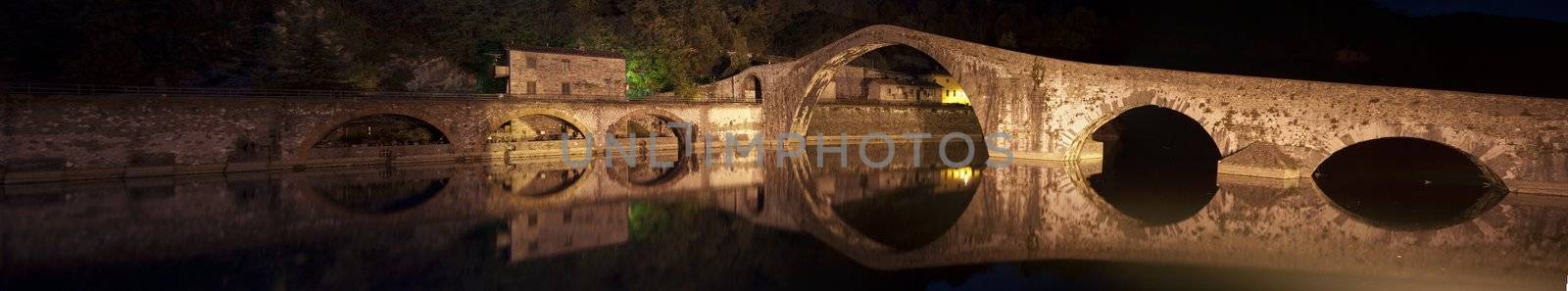 Colors and Reflections of Devils Bridge at Night, Italy