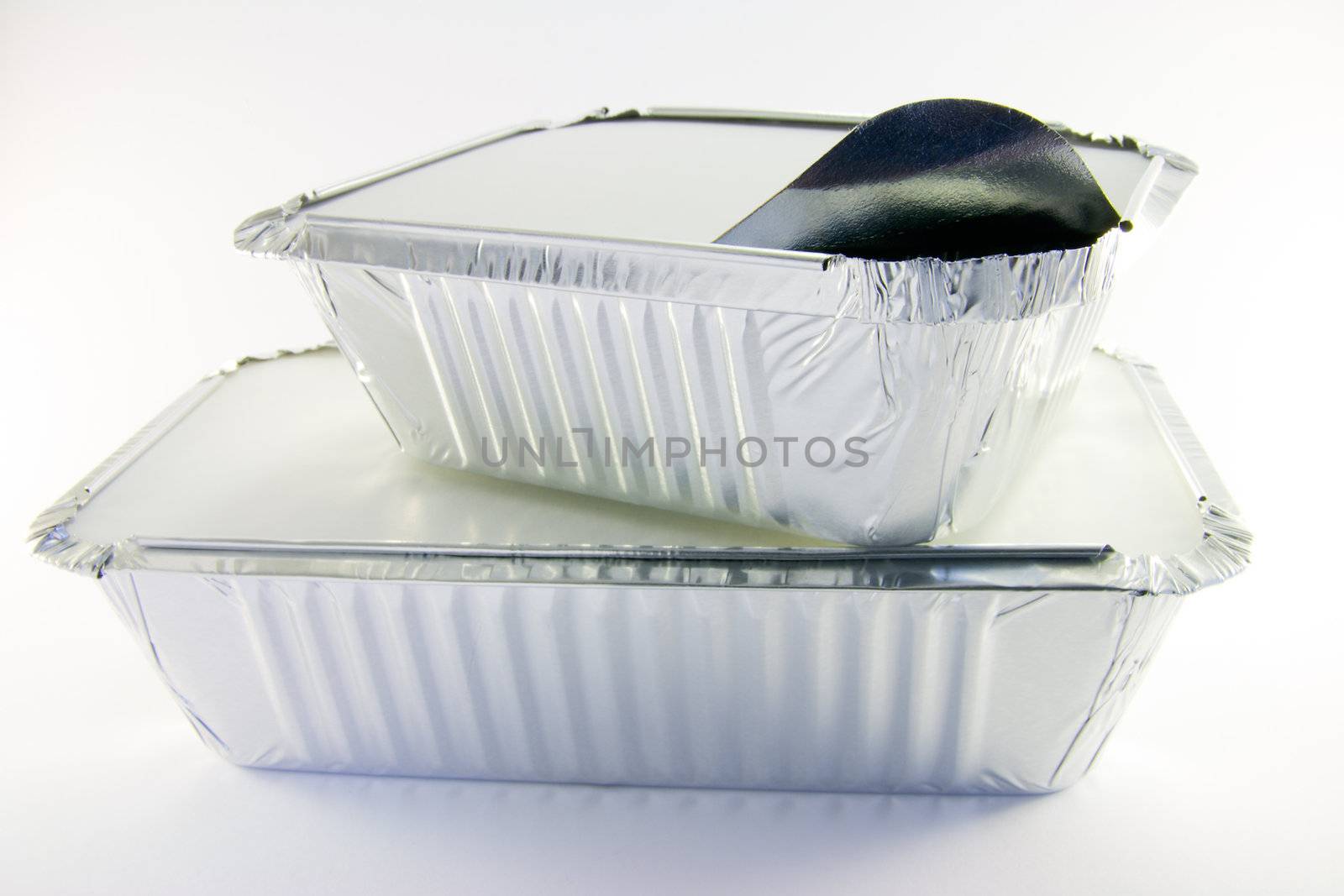 1 rectangle and 1 square partly opened catering trays