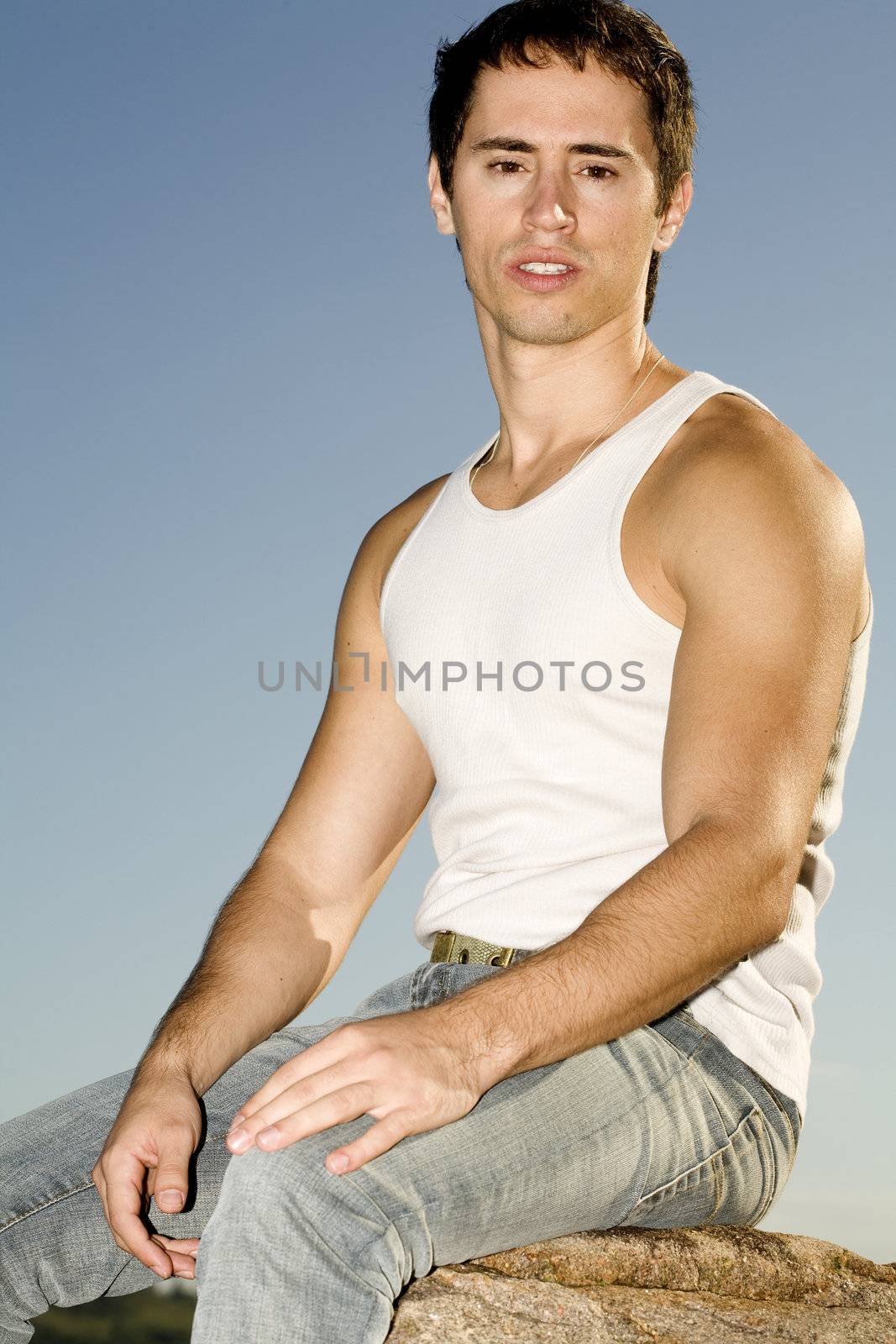 A young male model from Brazil in outdoors photograph.