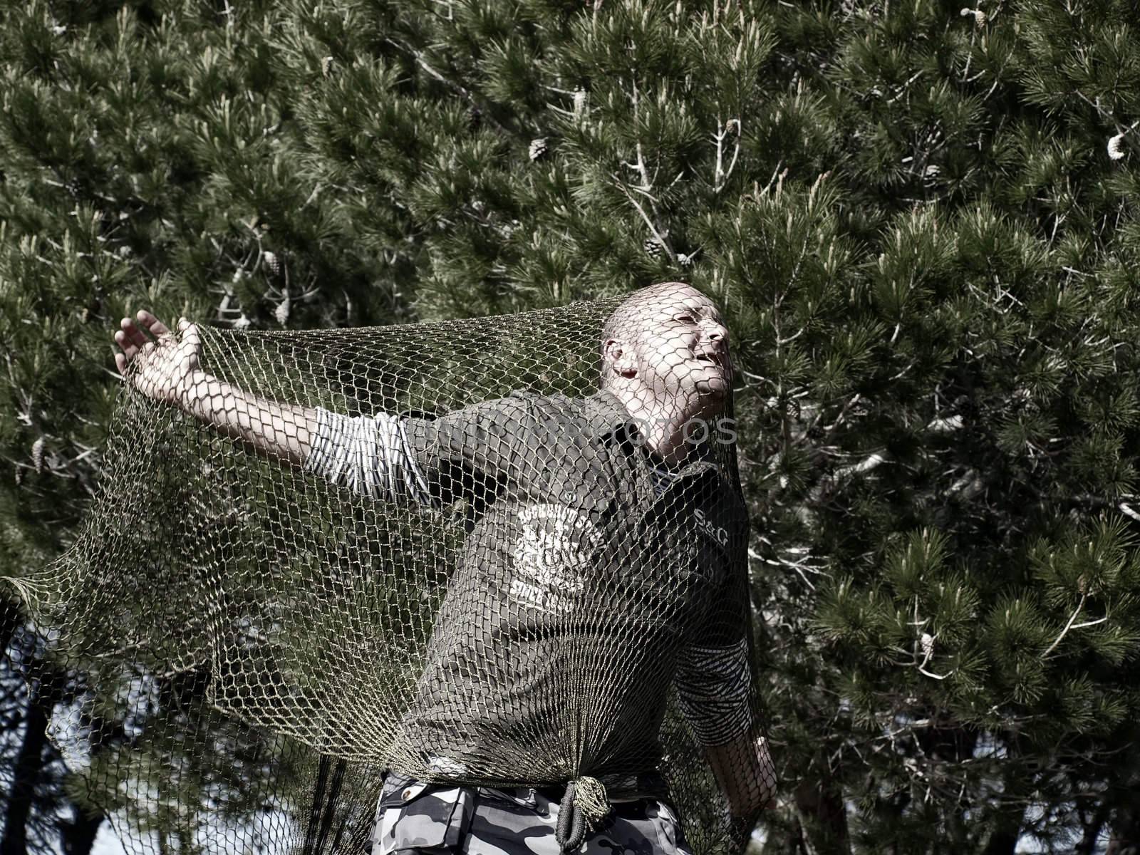 Man Caught in Net by PhotoWorks