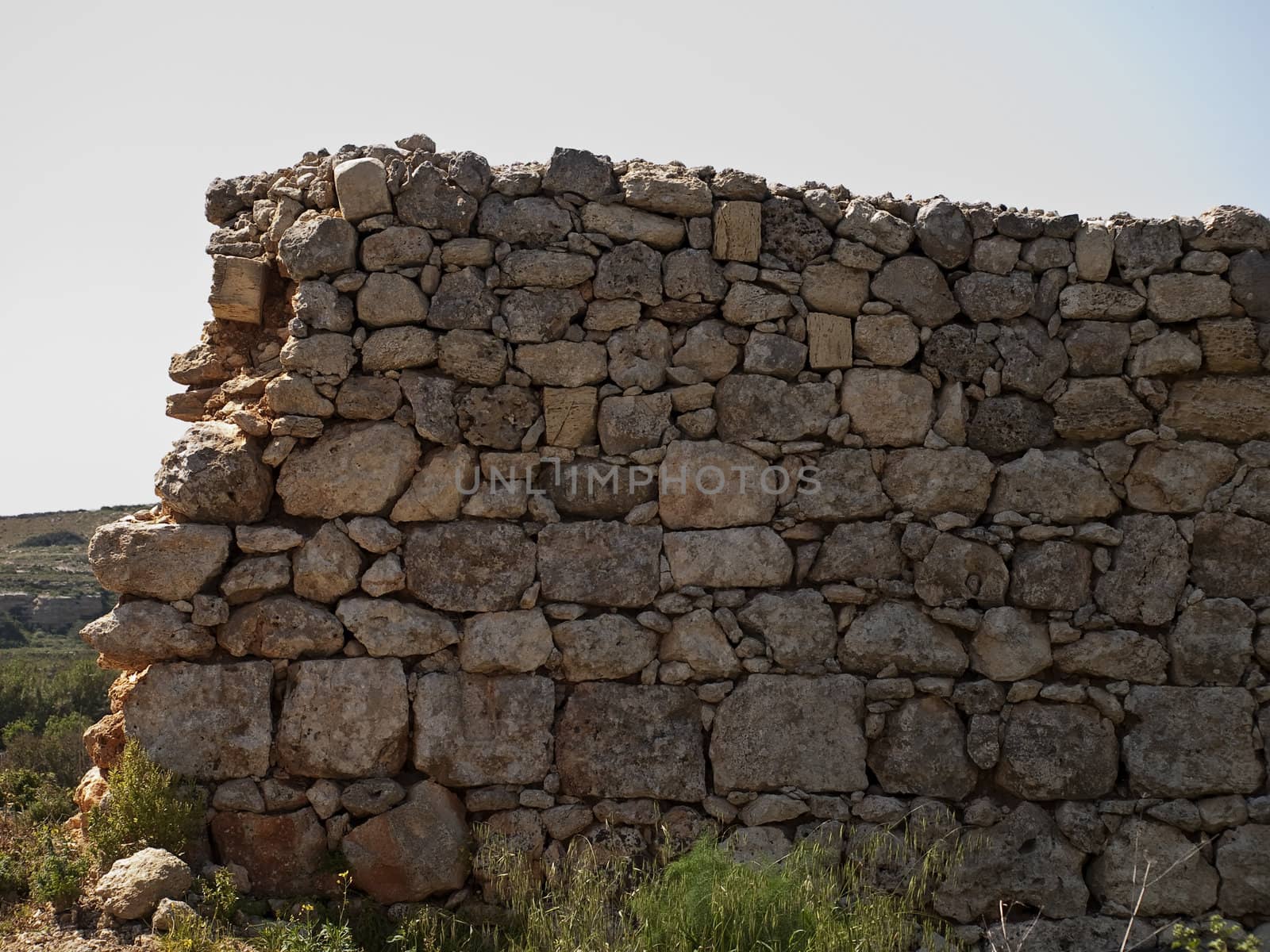 An old and neglected historic Roman wall on the island of Malta