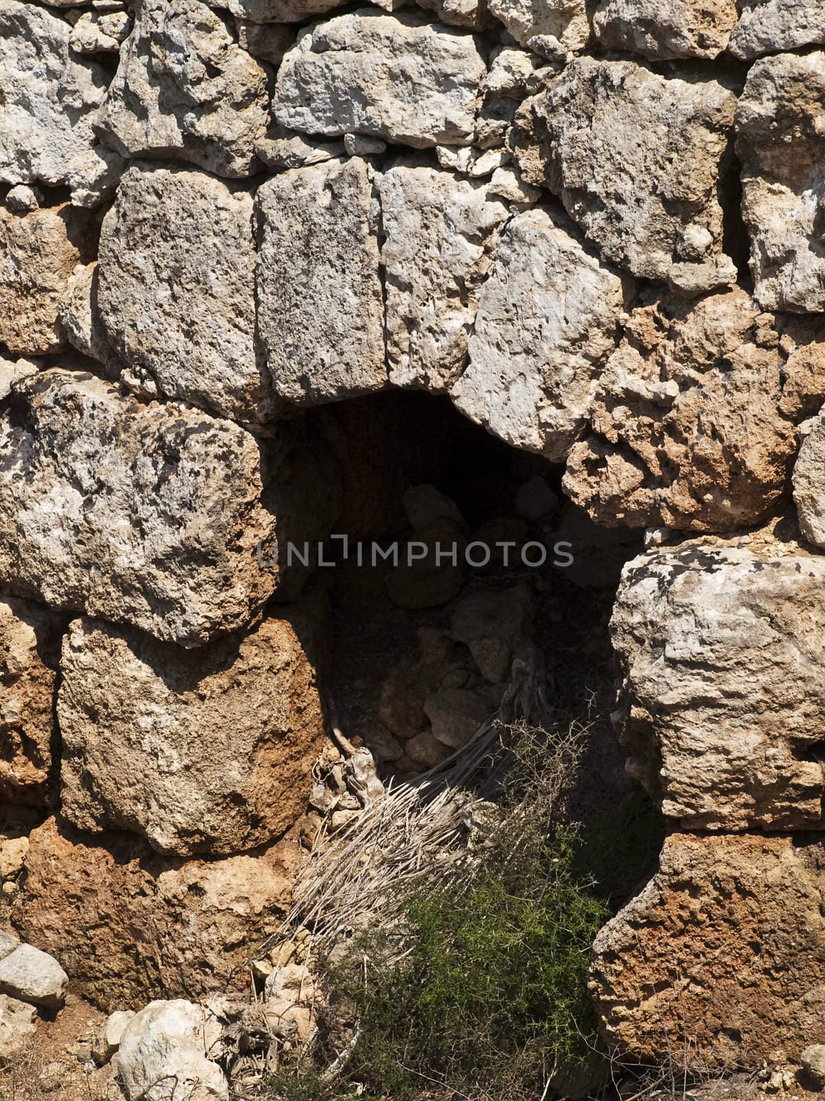 An old and neglected historic Roman wall and door on the island of Malta