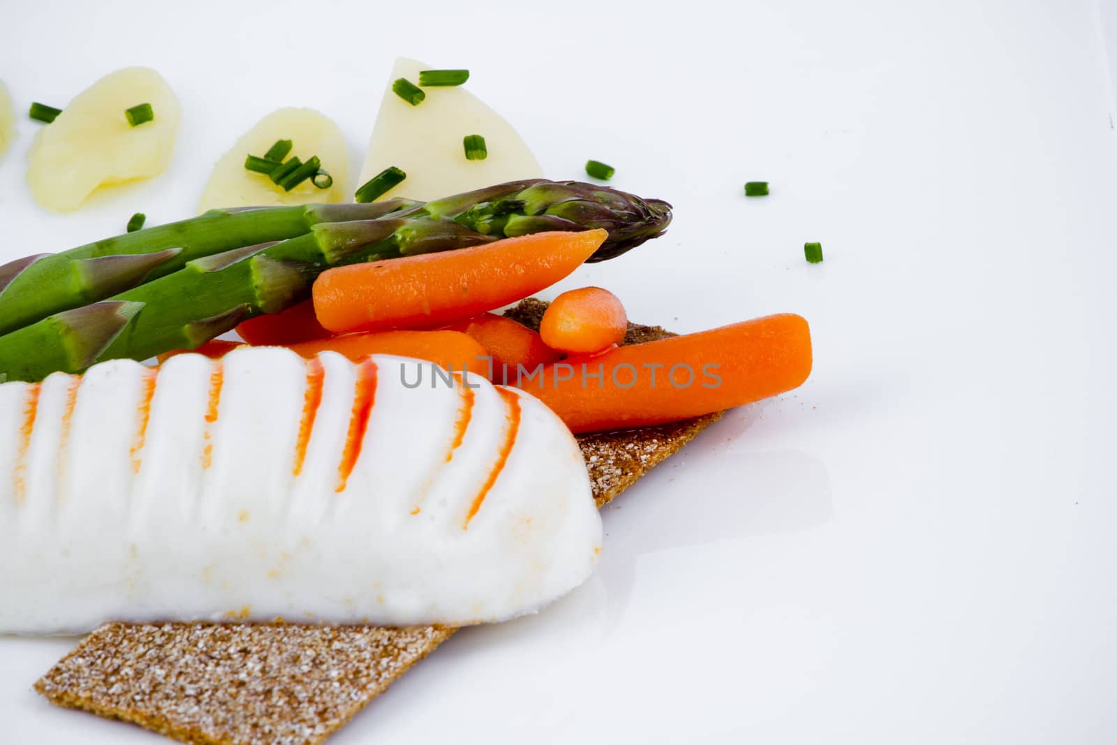 Diet meal, asparagus with carrots and sea food