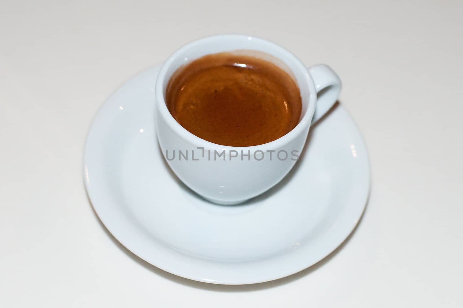 Cup of espresso coffee on the white background