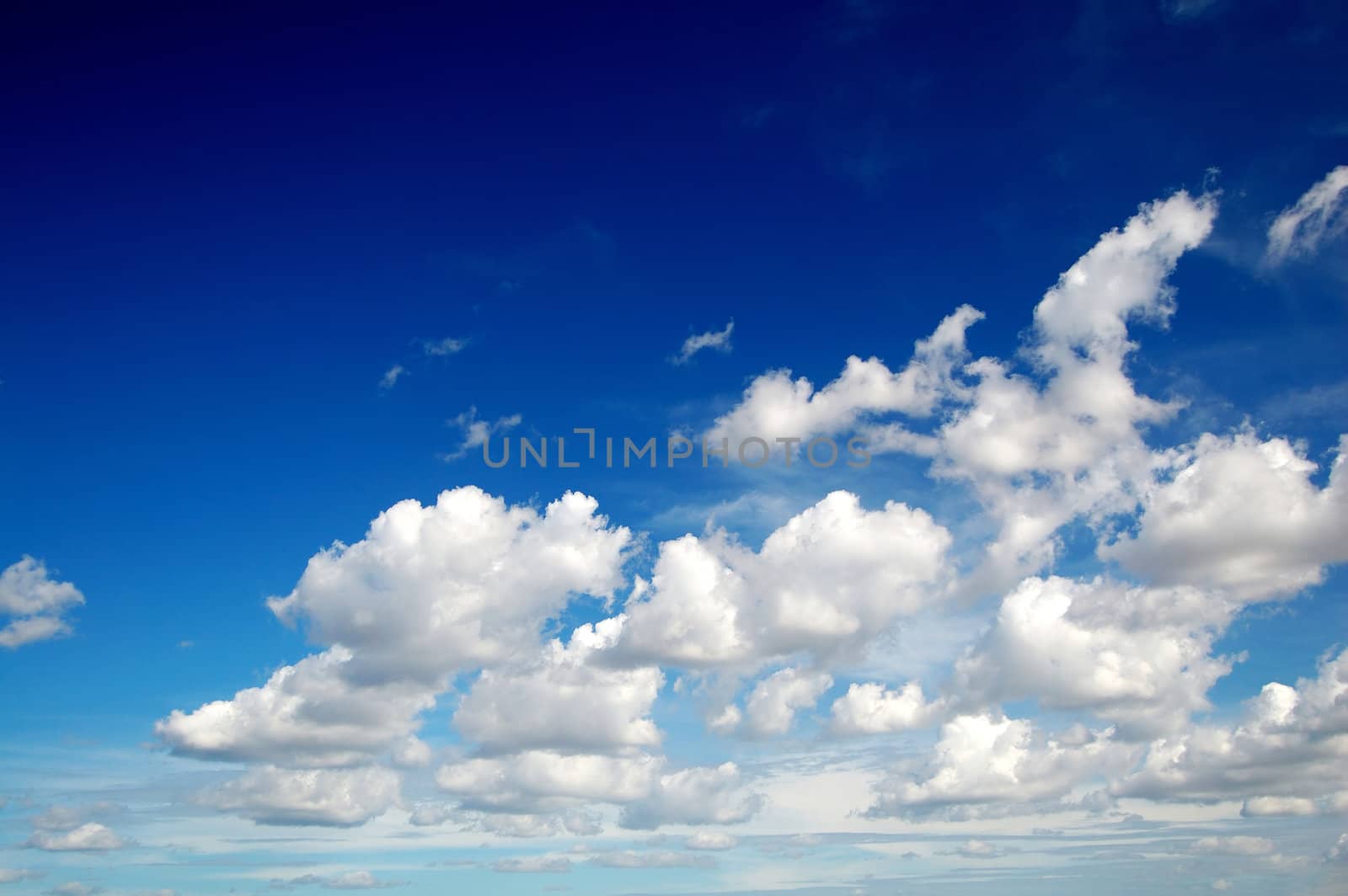 Blue sky with cotton like clouds