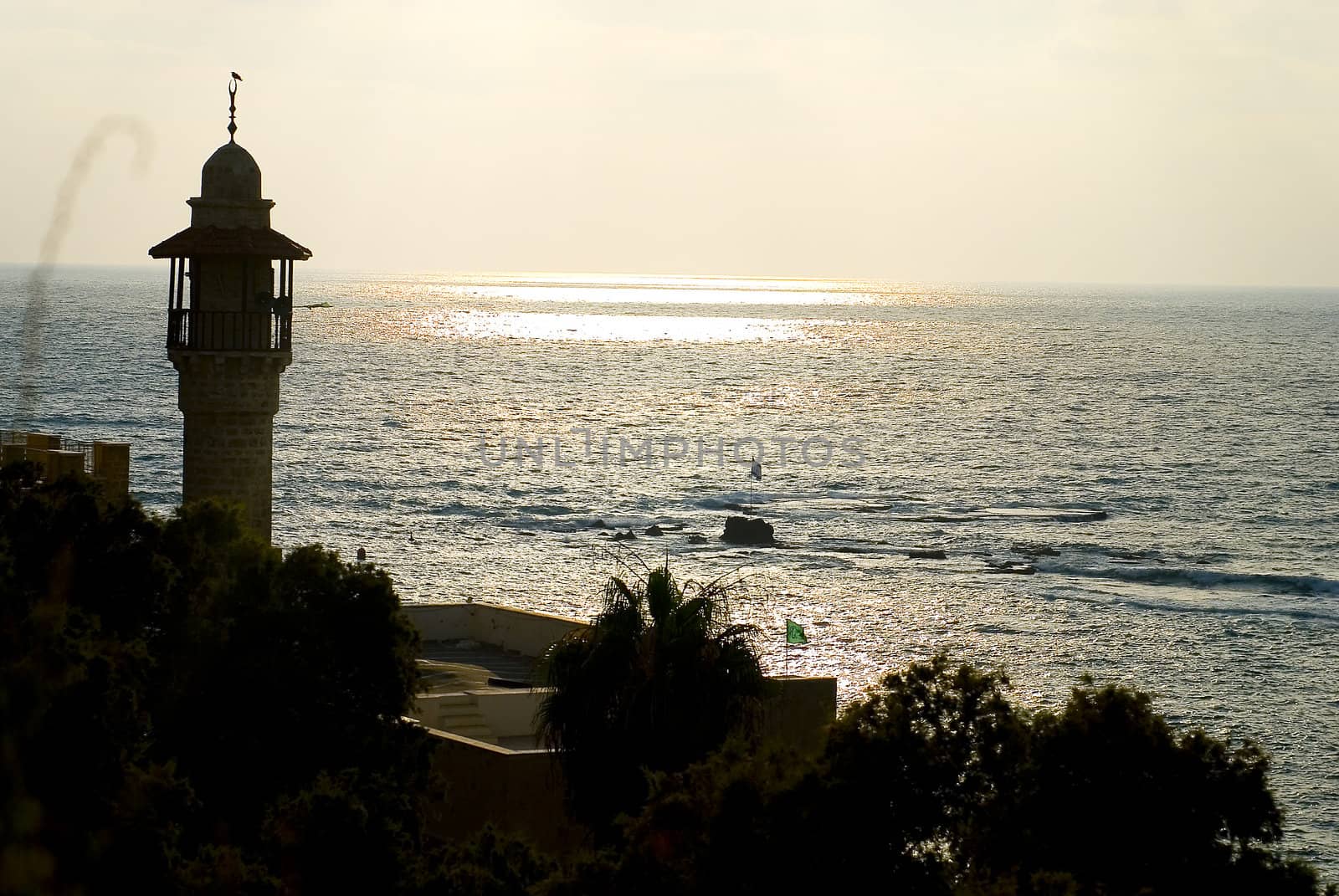 Minaret of mosque with the view on the sea