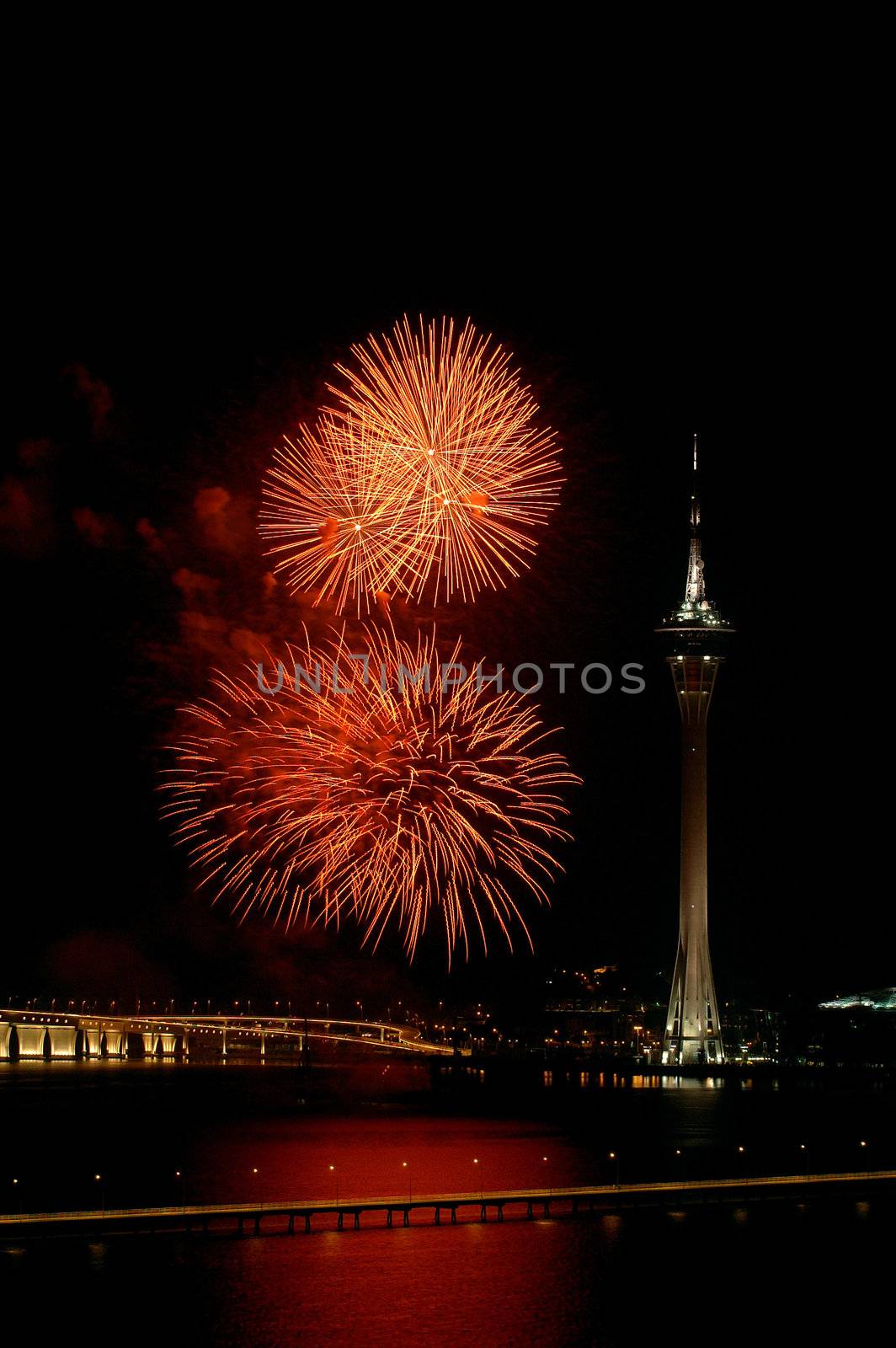 Celebration of New Year in Macau with fireworks beside the Tower Convention and Sai Van bridge