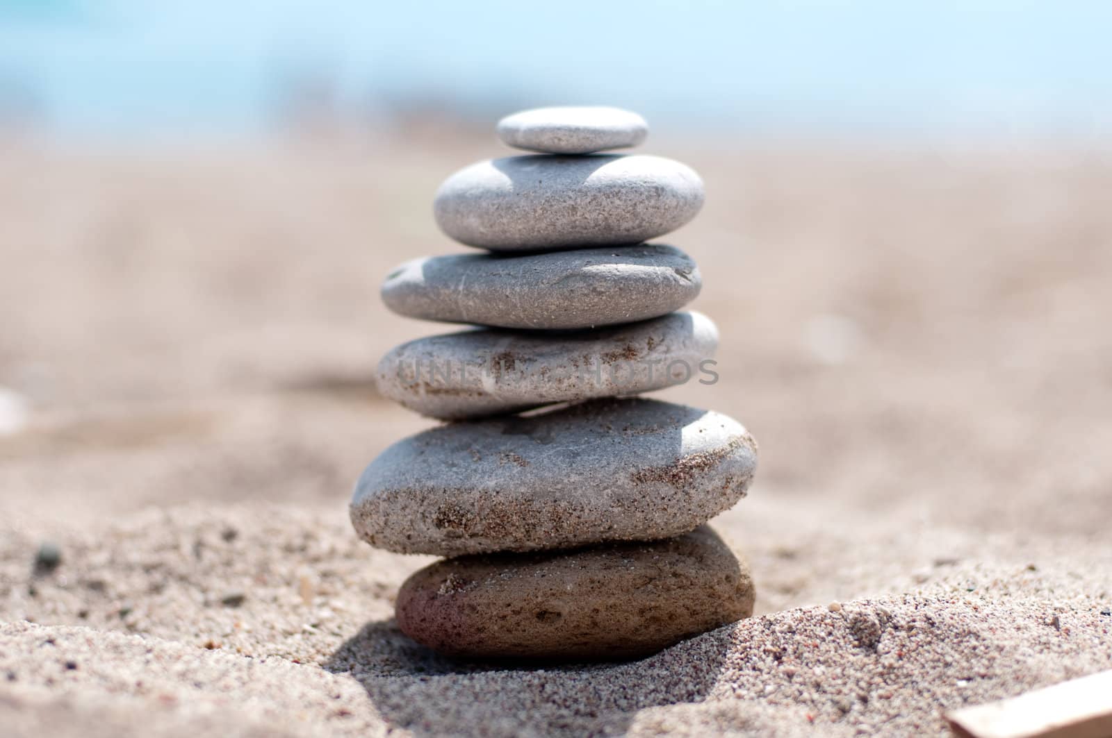 Zen beach stones on the sand