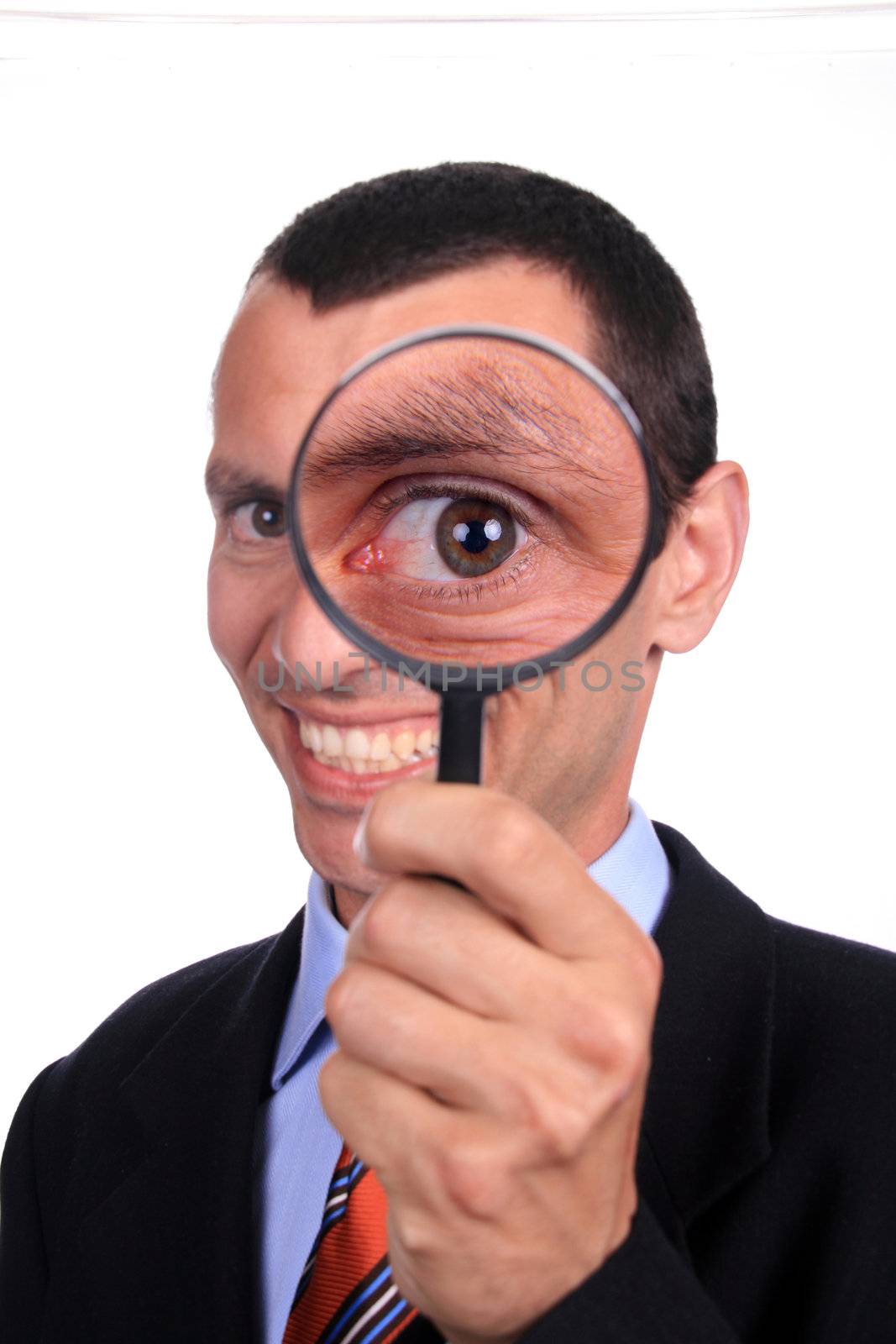 businessman with magnifying glass, isolated on white