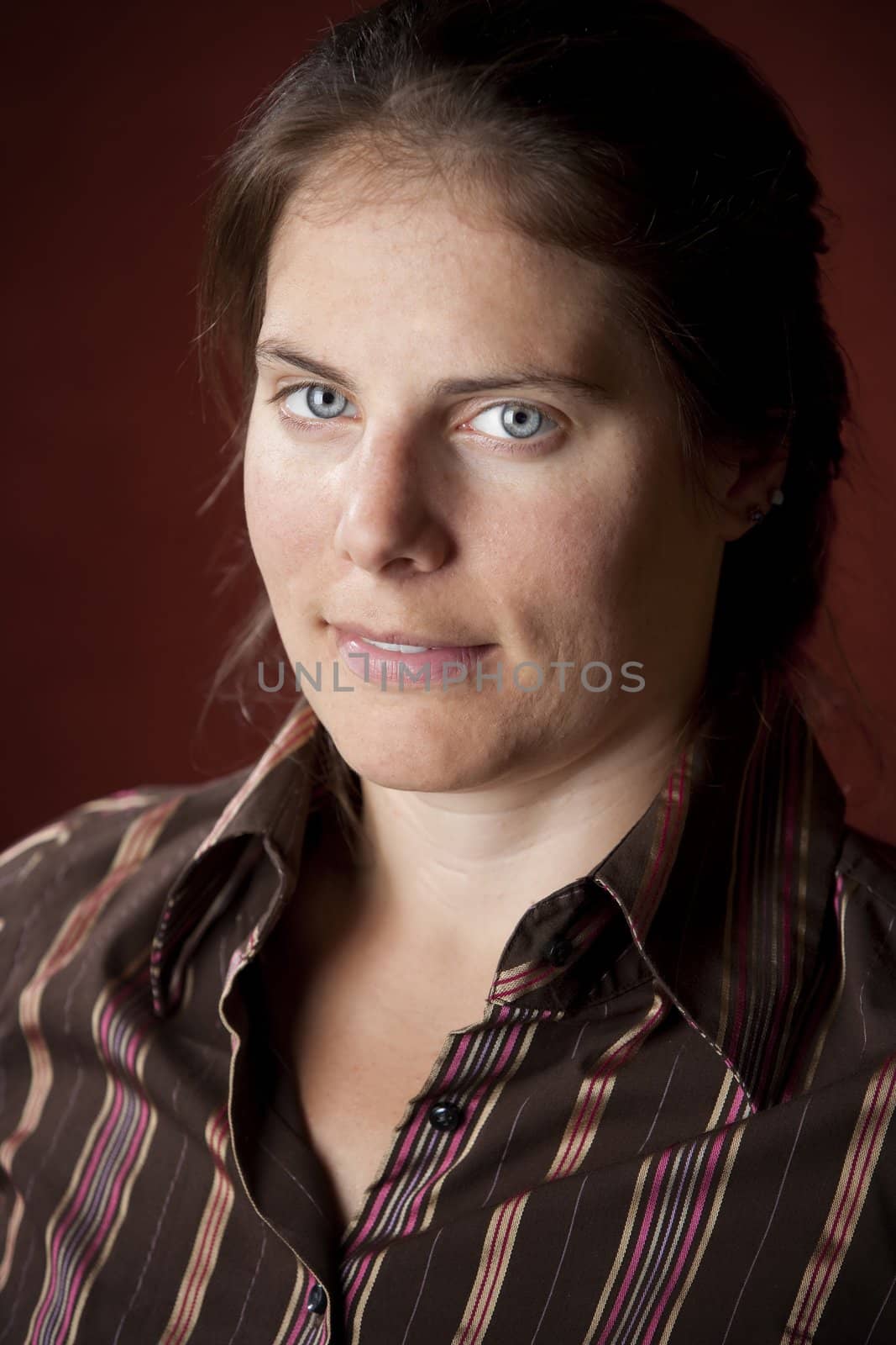 Vertical portrait of an attractive young brunette woman